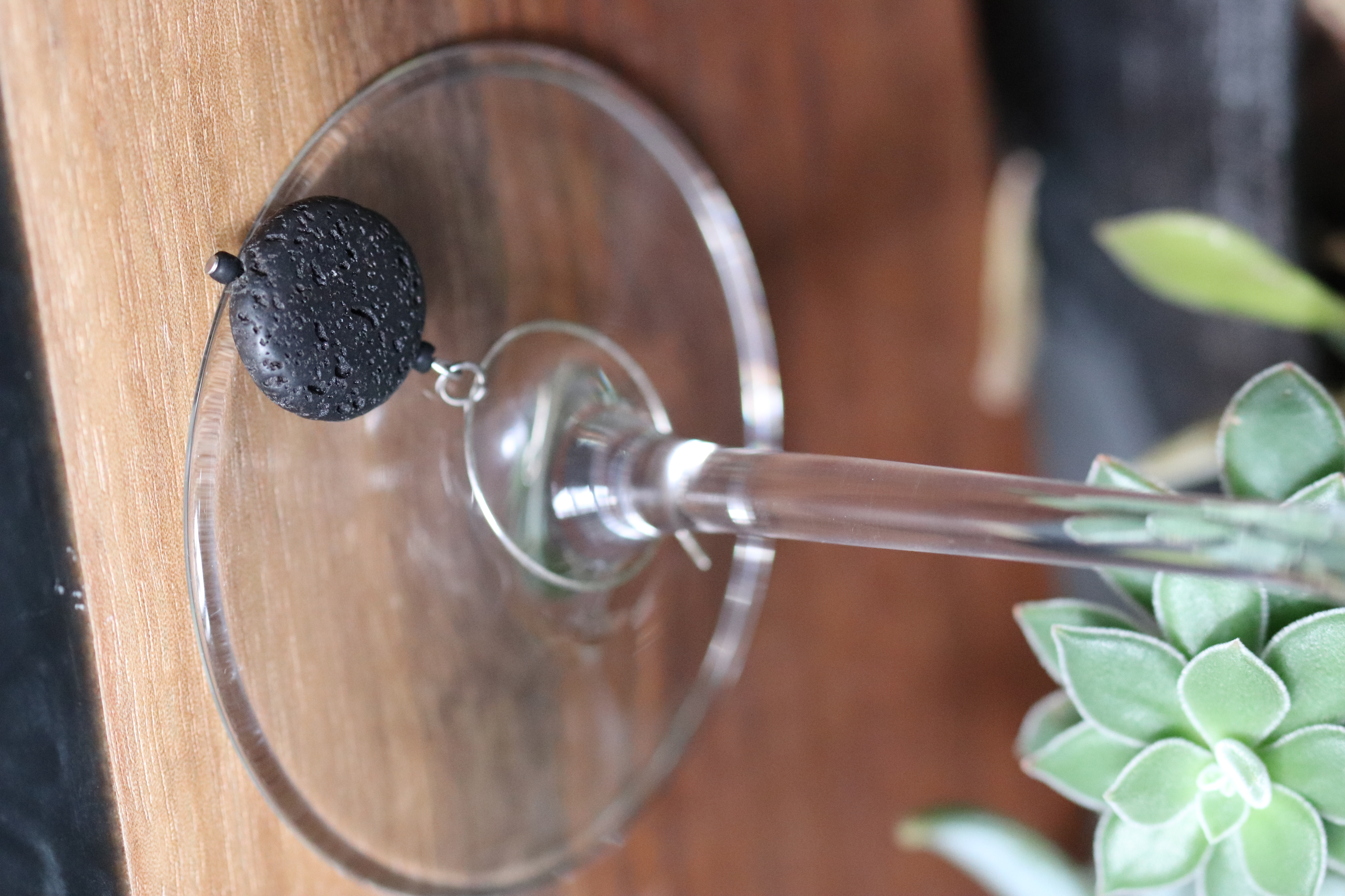 Black Lava Stone Wine Charm called "Solar Eclipse"