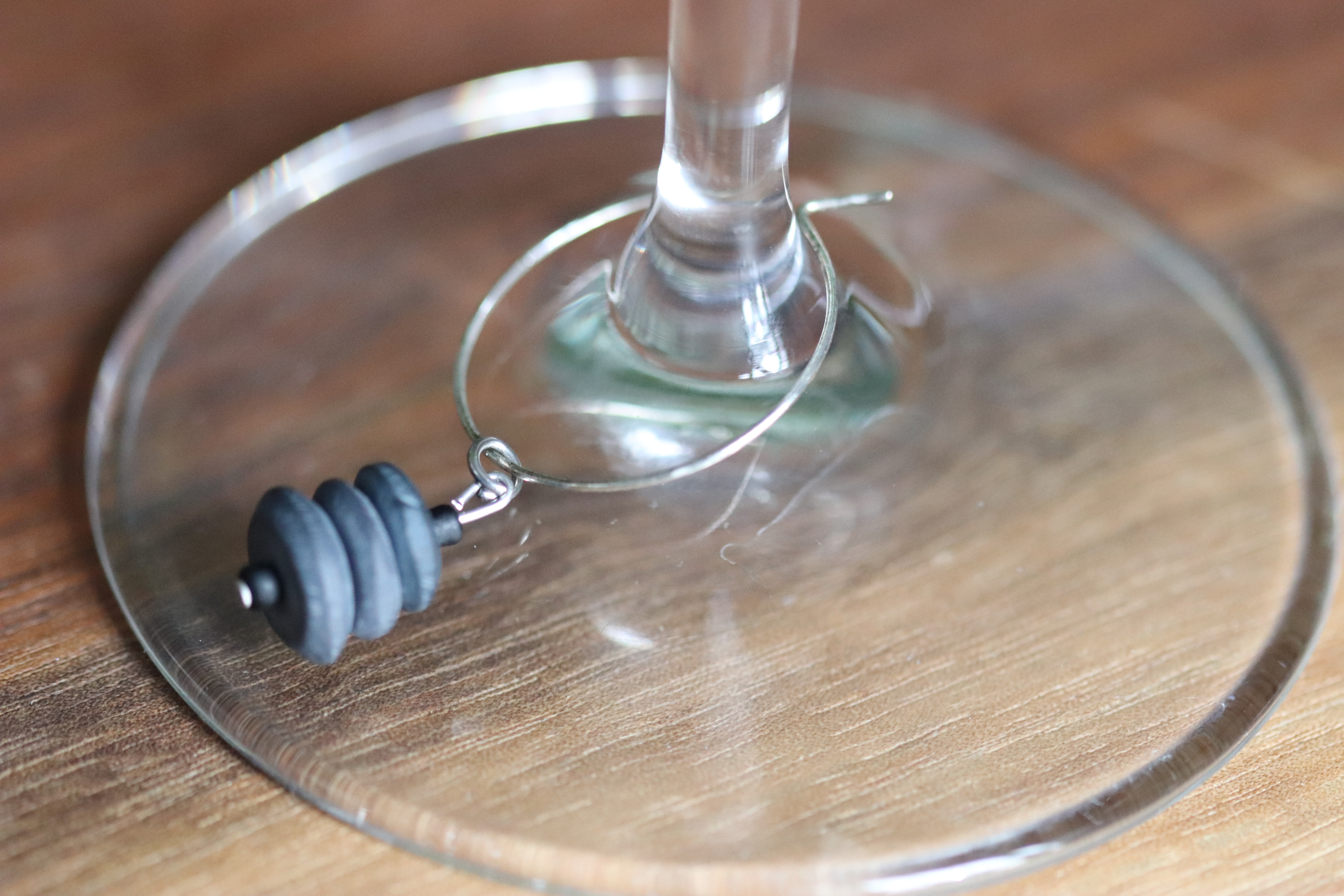 Black Stacked Ceramic Wine Charm called "Stacked Rocks"