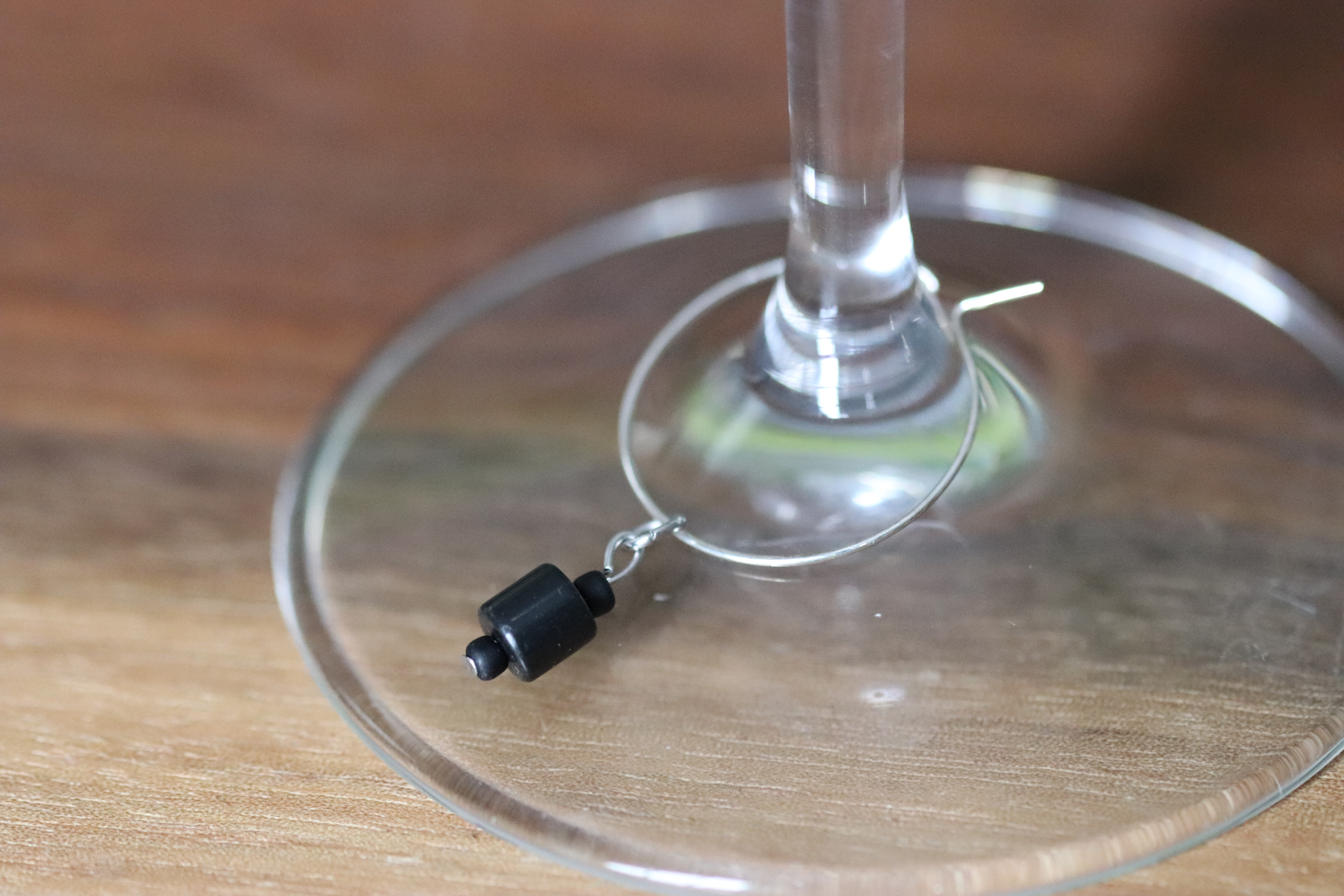 Black Jasper Stone Wine Glass Charm called "Rollin' Stone"