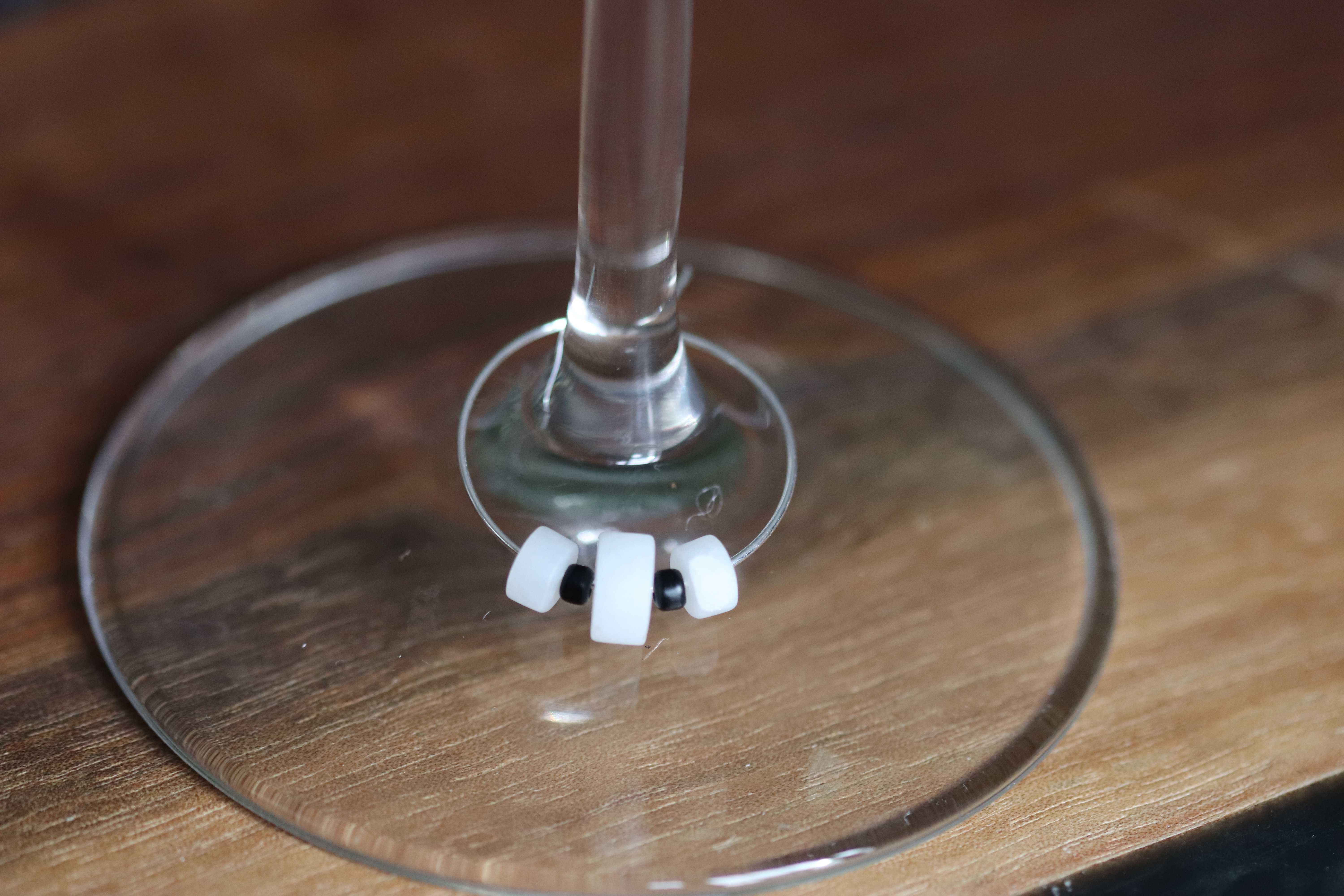 Unique White Quartz Wine Charm called "Something's in the snow"