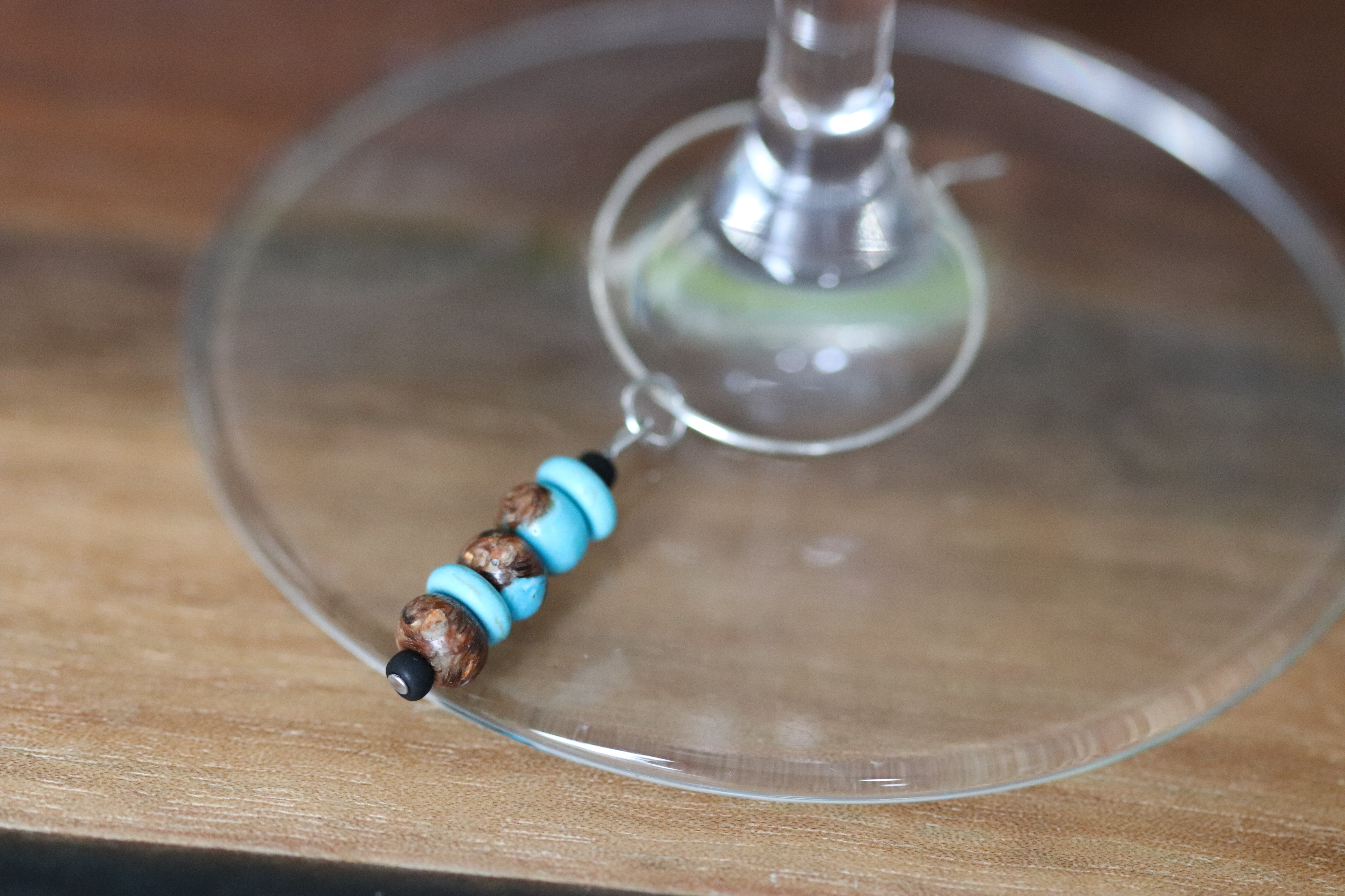 Turquoise and Brown Wine Charm called "Above the trees"
