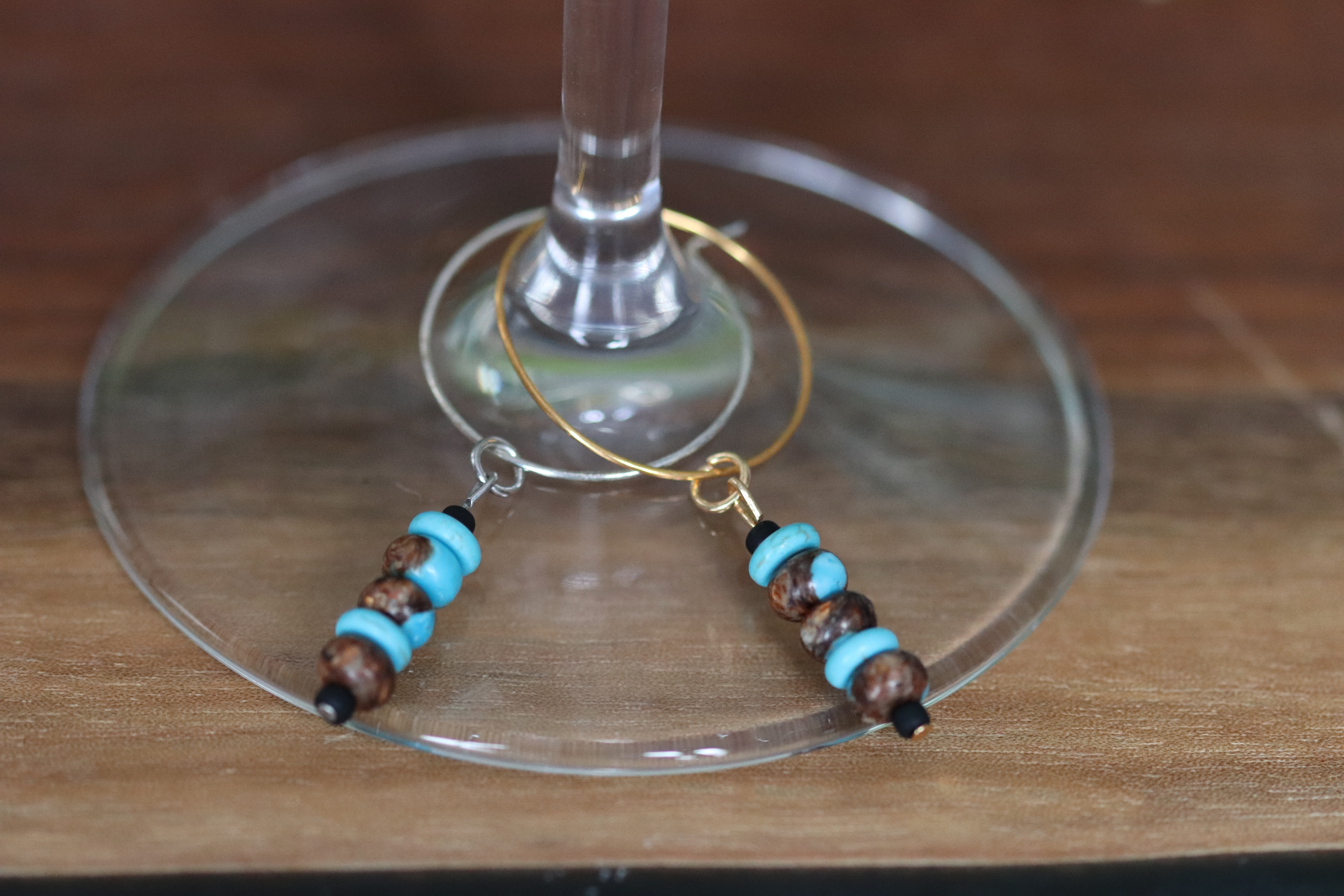 Turquoise and Brown Wine Charm called "Above the trees"