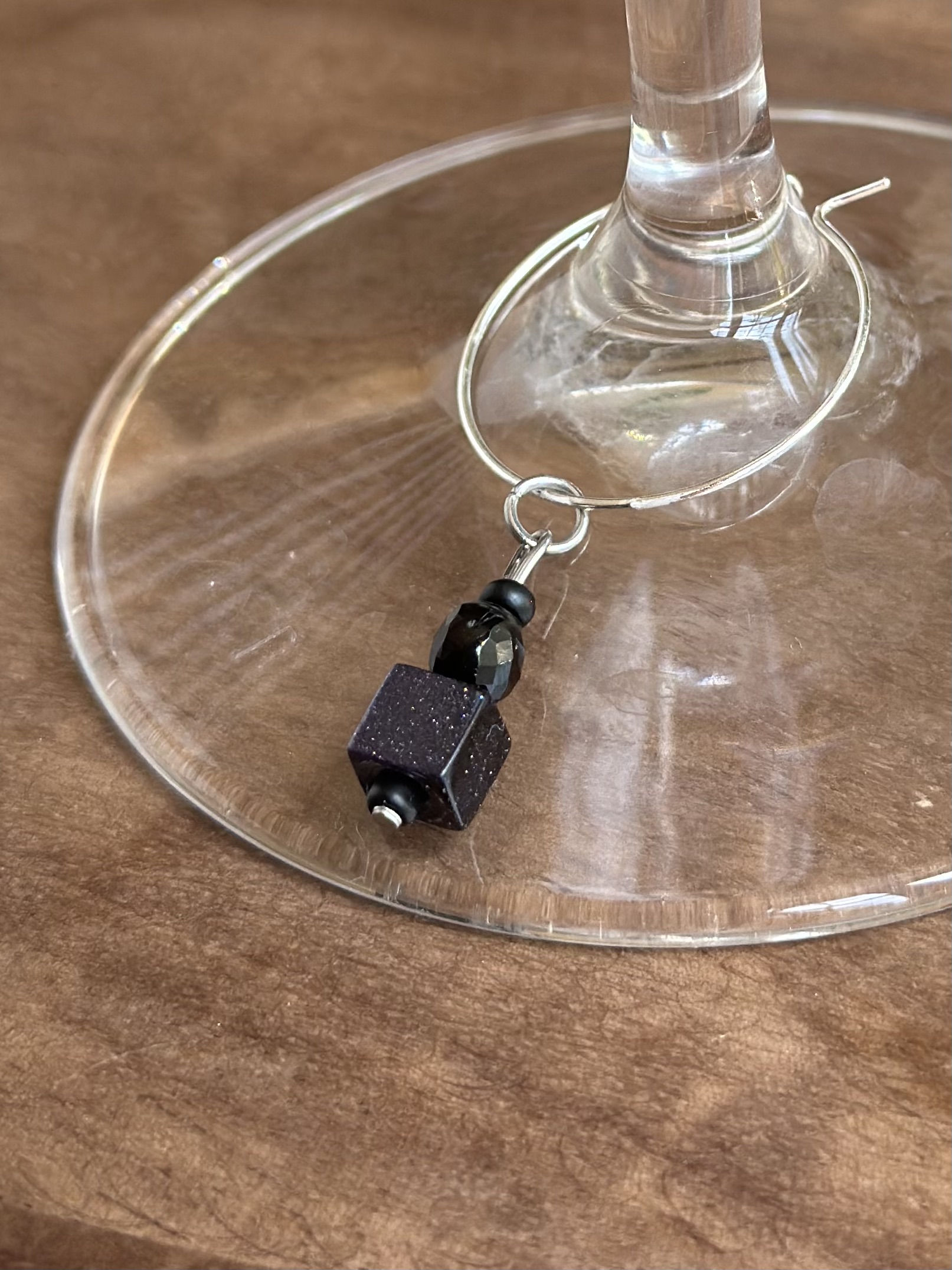 Shiny tuxedo black agate wine charm called "Red Carpet Worthy"