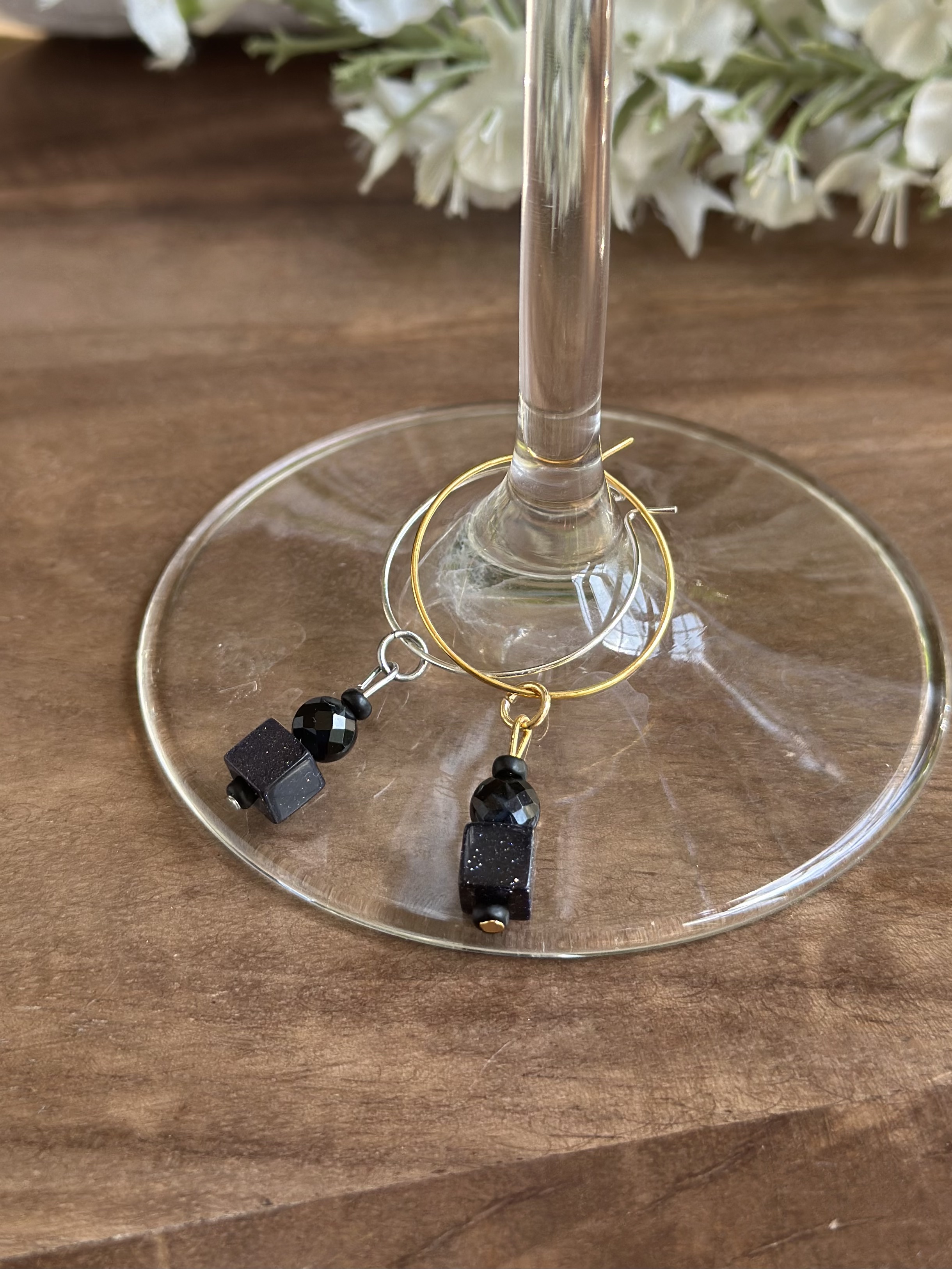 Shiny tuxedo black agate wine charm called "Red Carpet Worthy"