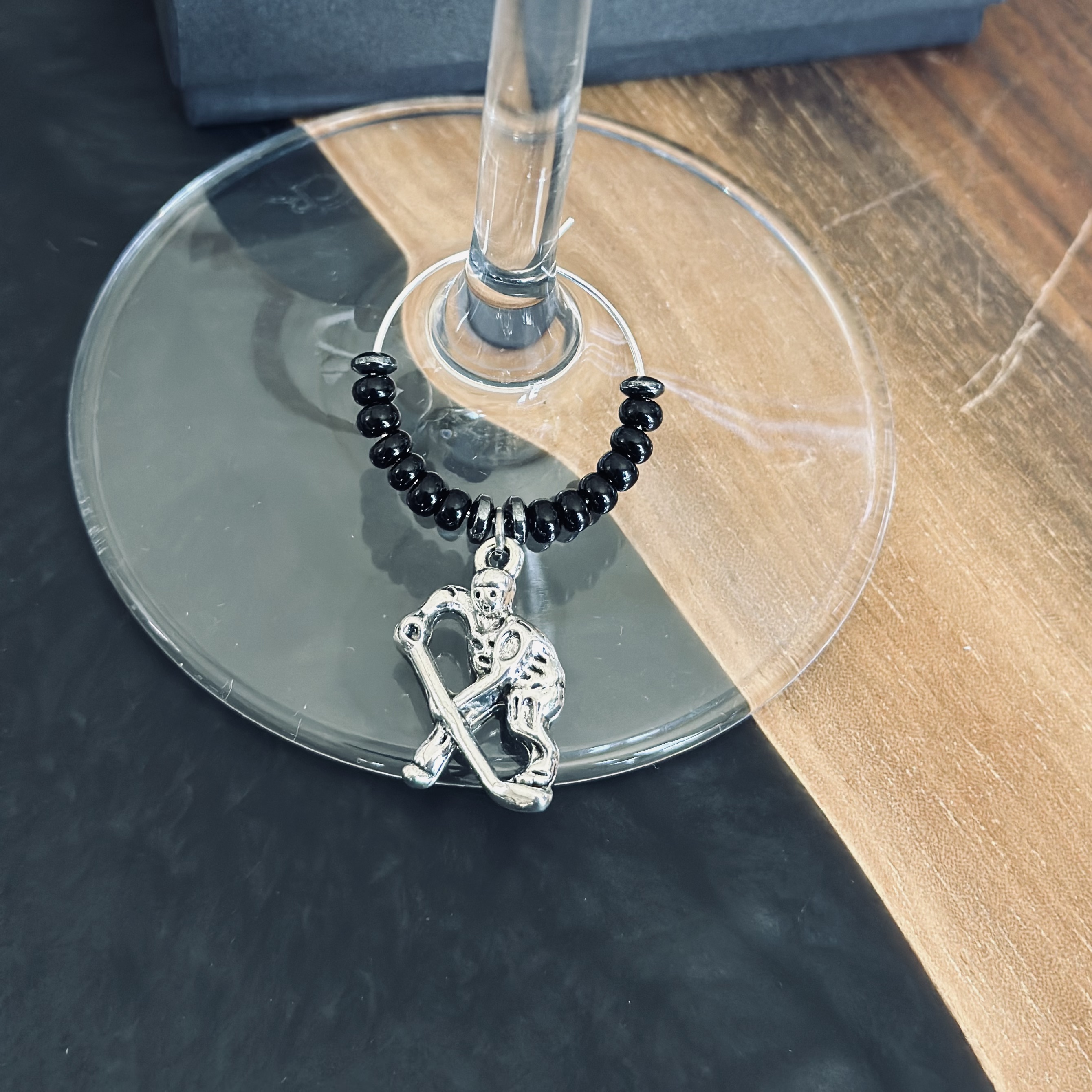 Hockey player wine charm 