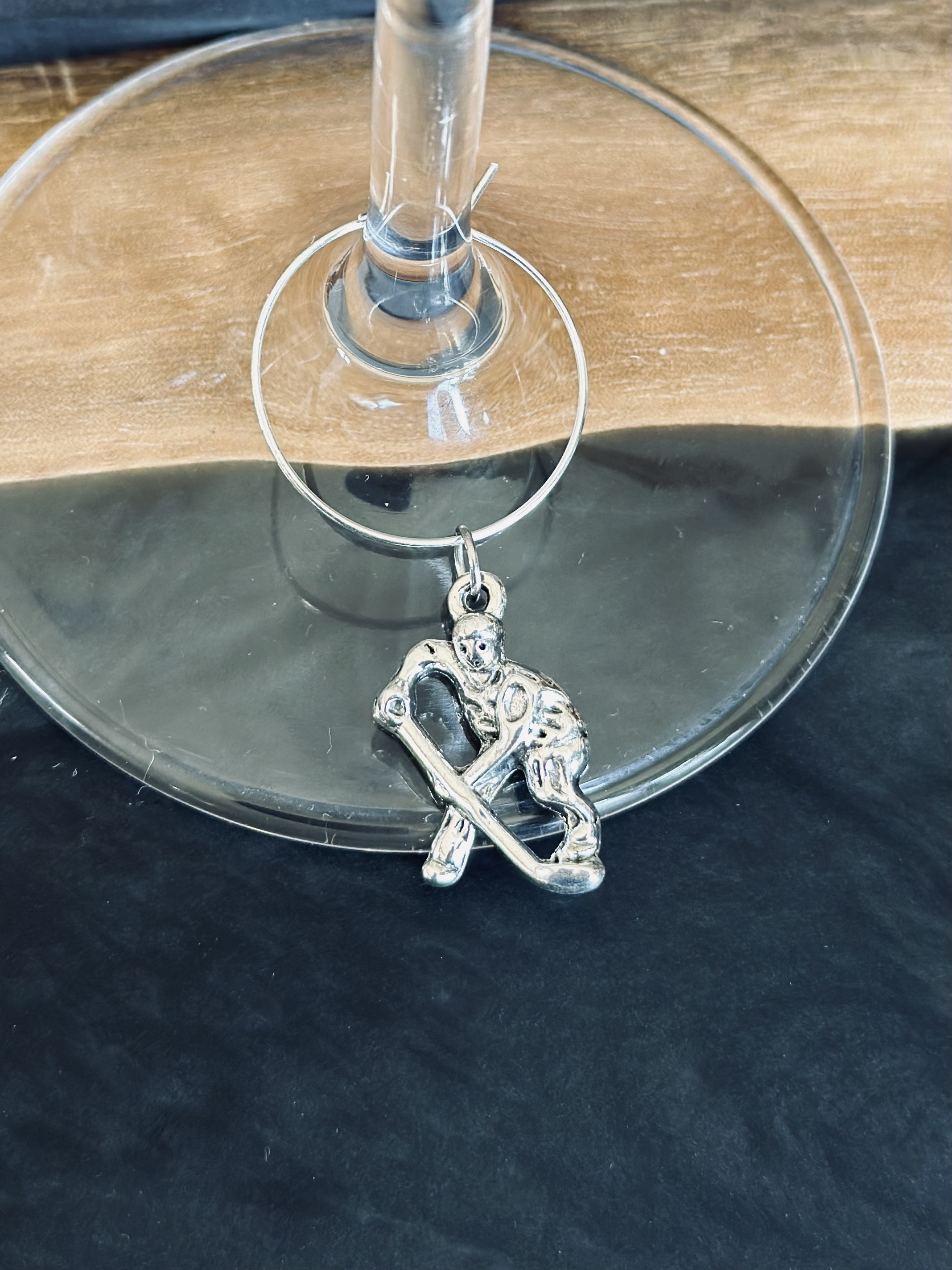 Hockey player wine charm 
