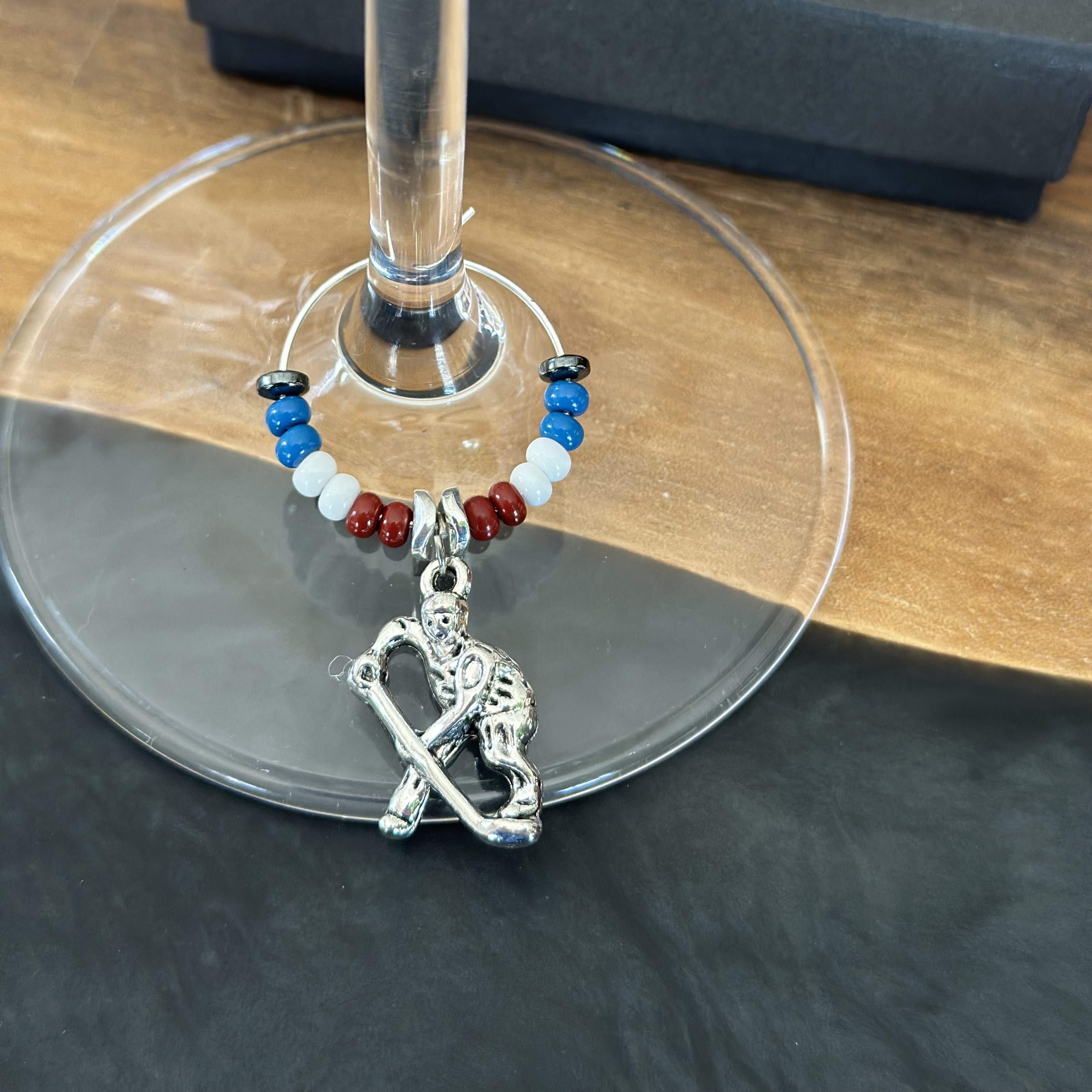 Hockey player wine charm 
