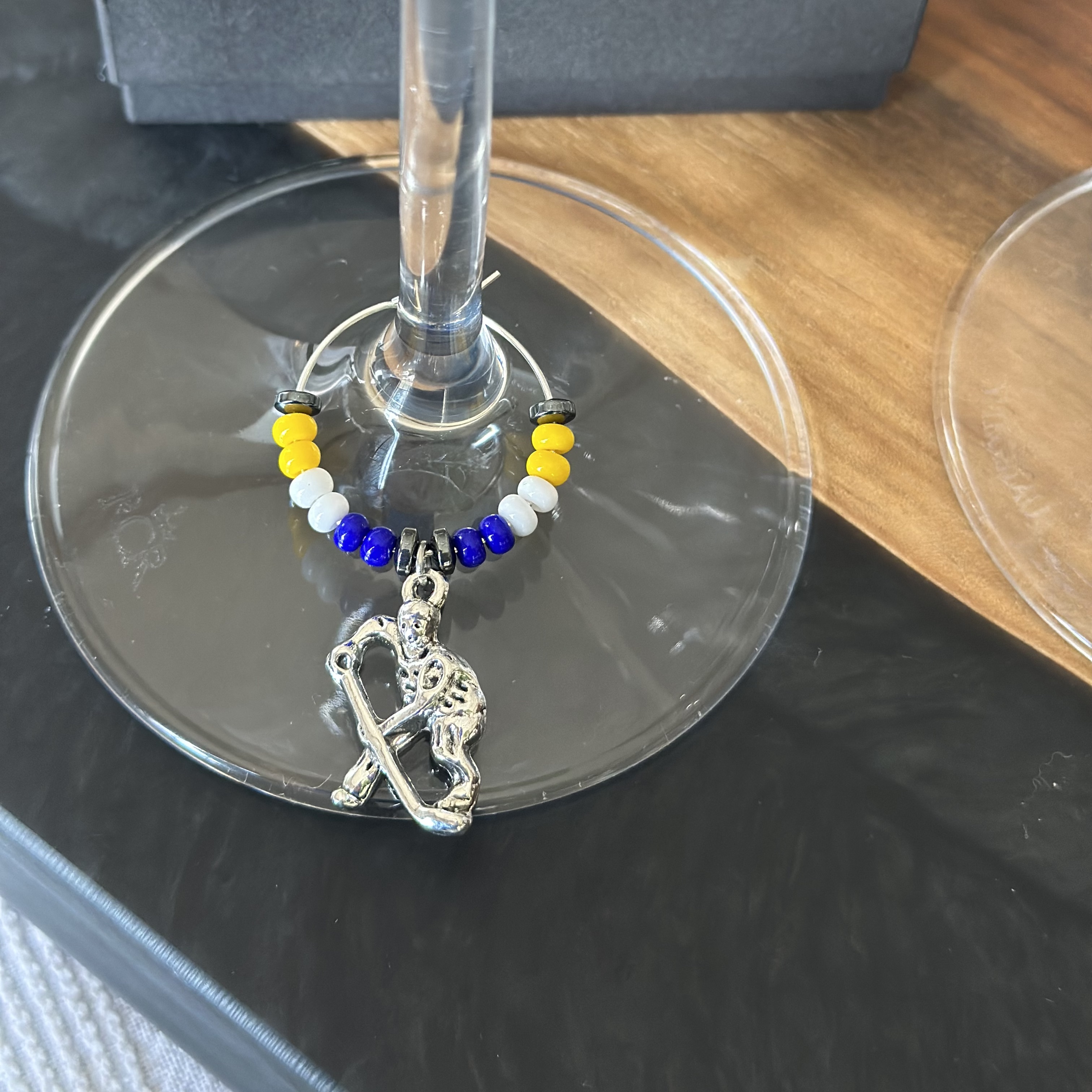 Hockey player wine charm 