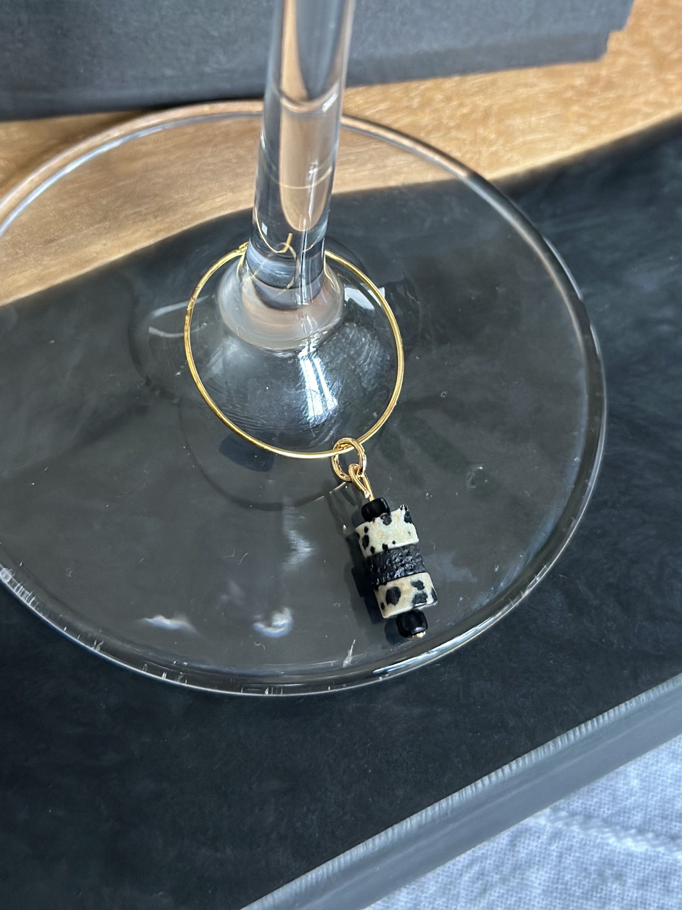 Unique Dalmatian Jasper and Lava stone wine charm called "Cookies and Cream"