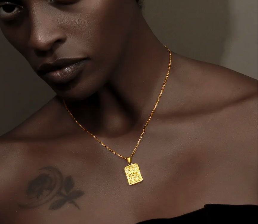 Ancient Sun Symbol and Aphrodite's Hand Amulet