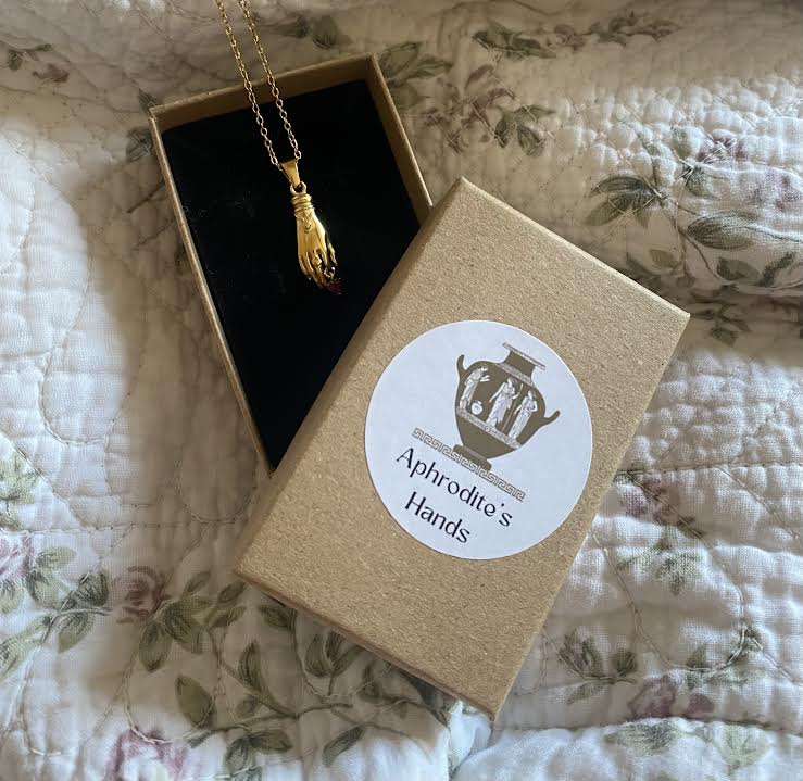 The Goddess' Hand Pendant with Red Gemstone