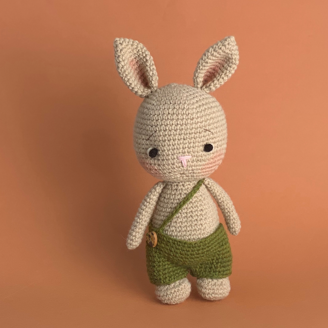 Handmade Crochet Bunny Doll wearing green overalls in 100% Alpaca Wool