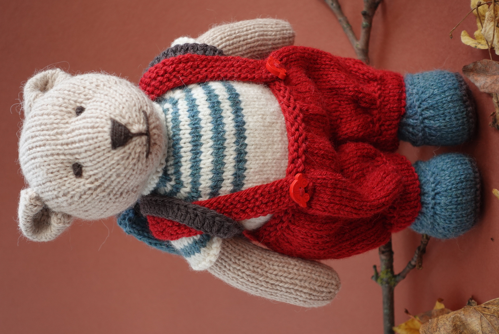 Hand-Knitted Teddy Bear in red overalls and a backpack in 100% Alpaca and Merino Wool