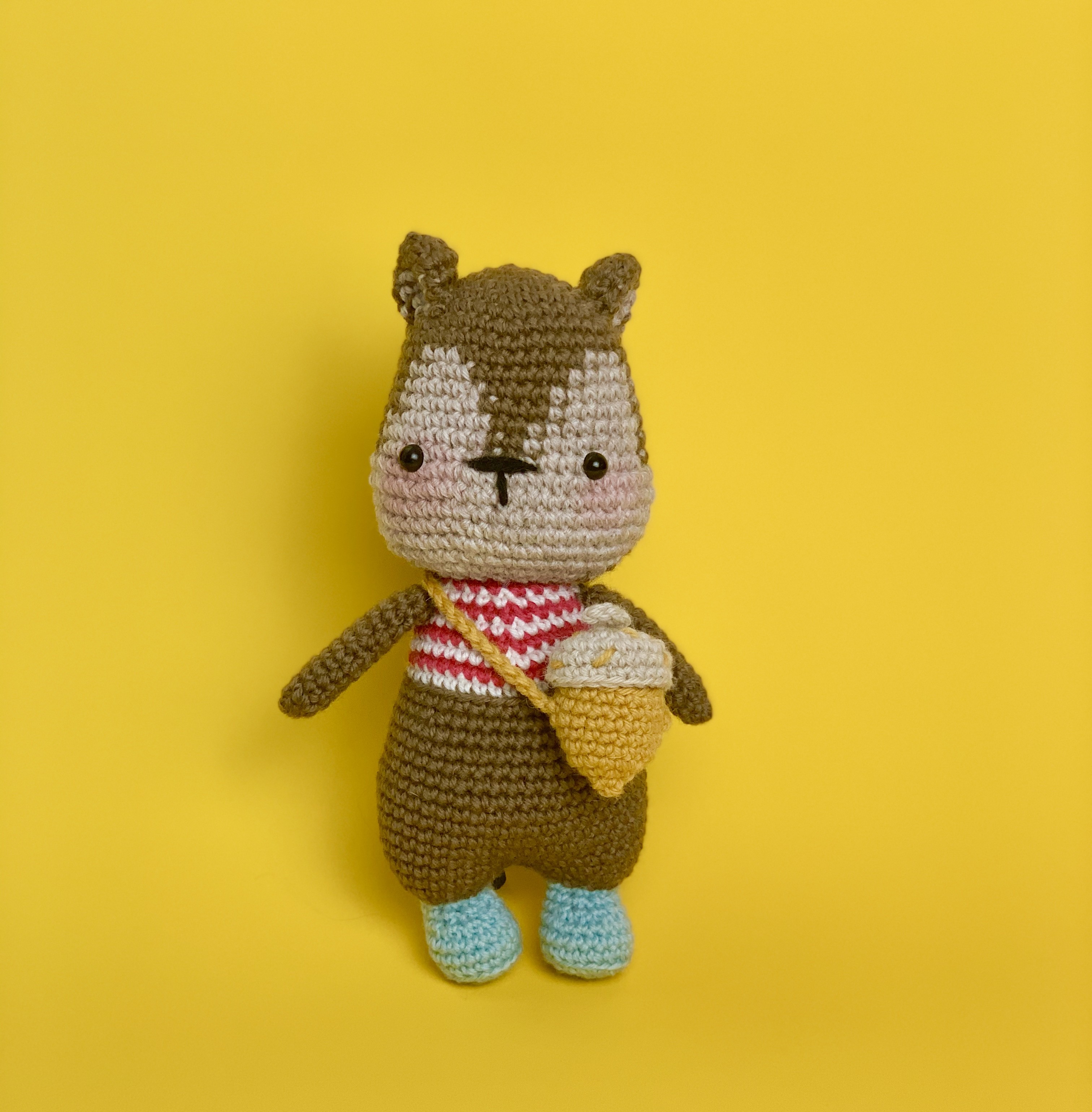 Handmade Crochet Squirrel Toy with a nut sling bag and its acorn in 100% Merino Wool