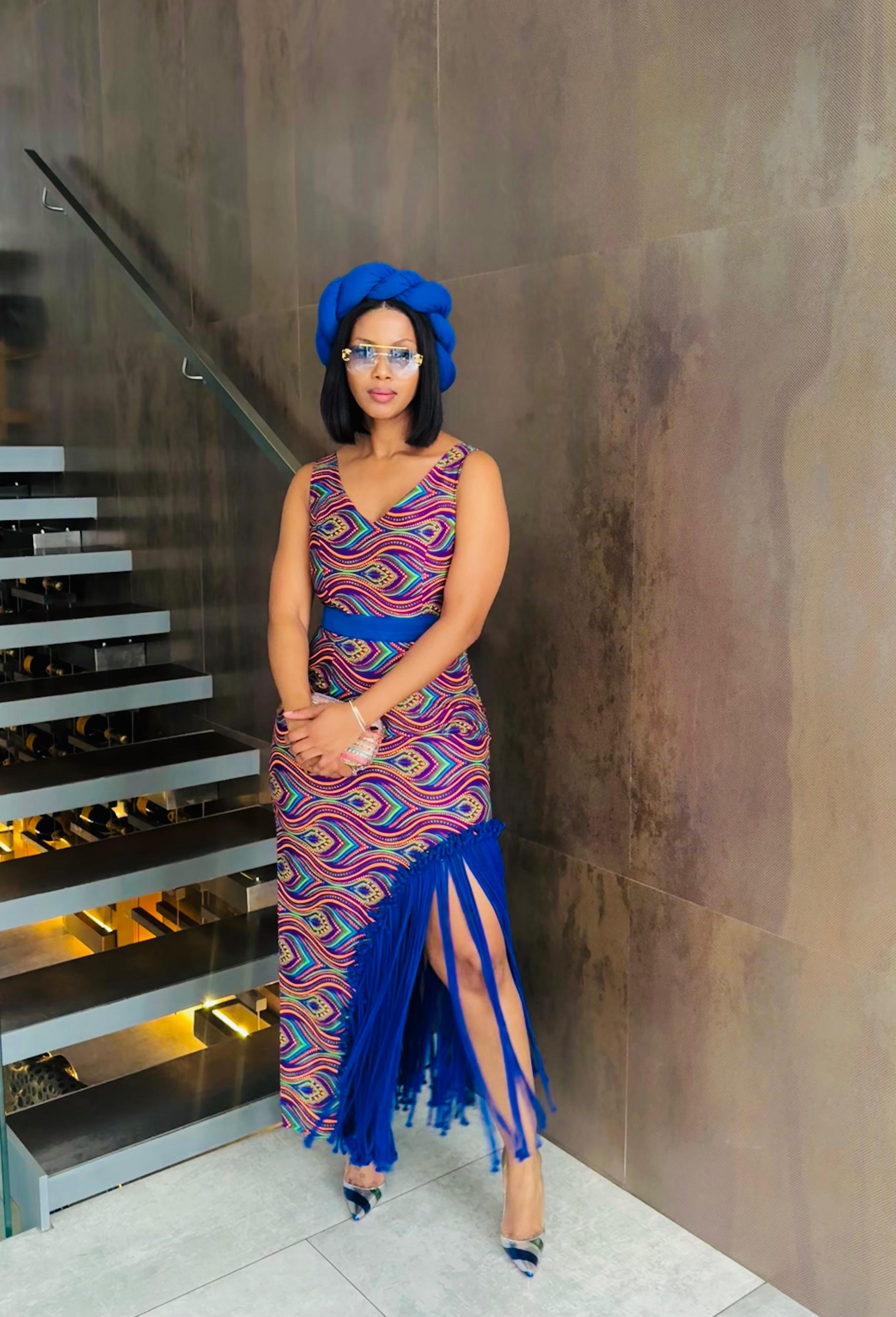 Multicoloured dress with the blue tassels
