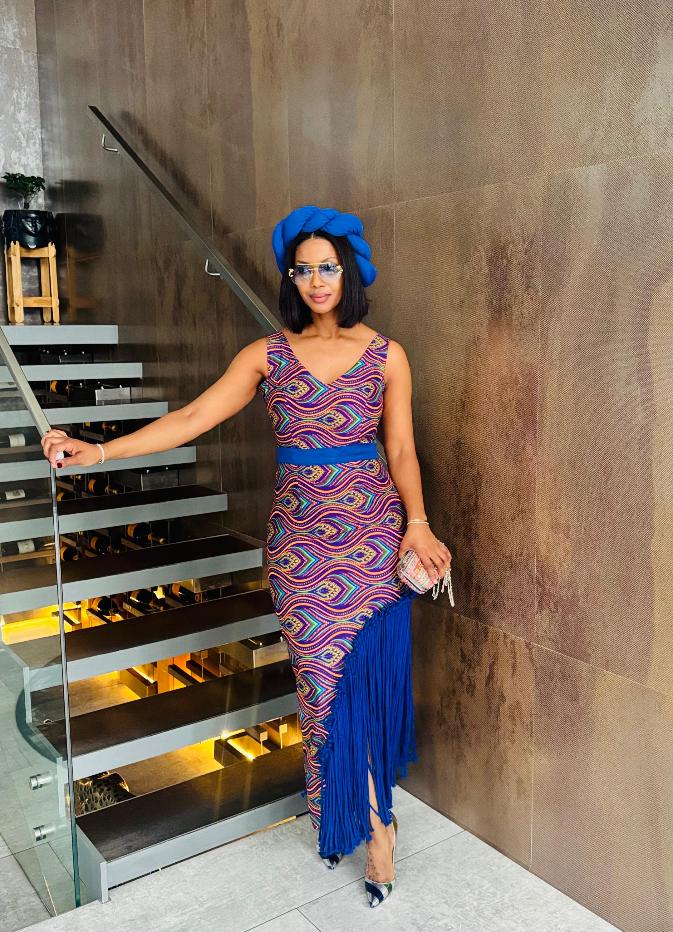 Multicoloured dress with the blue tassels
