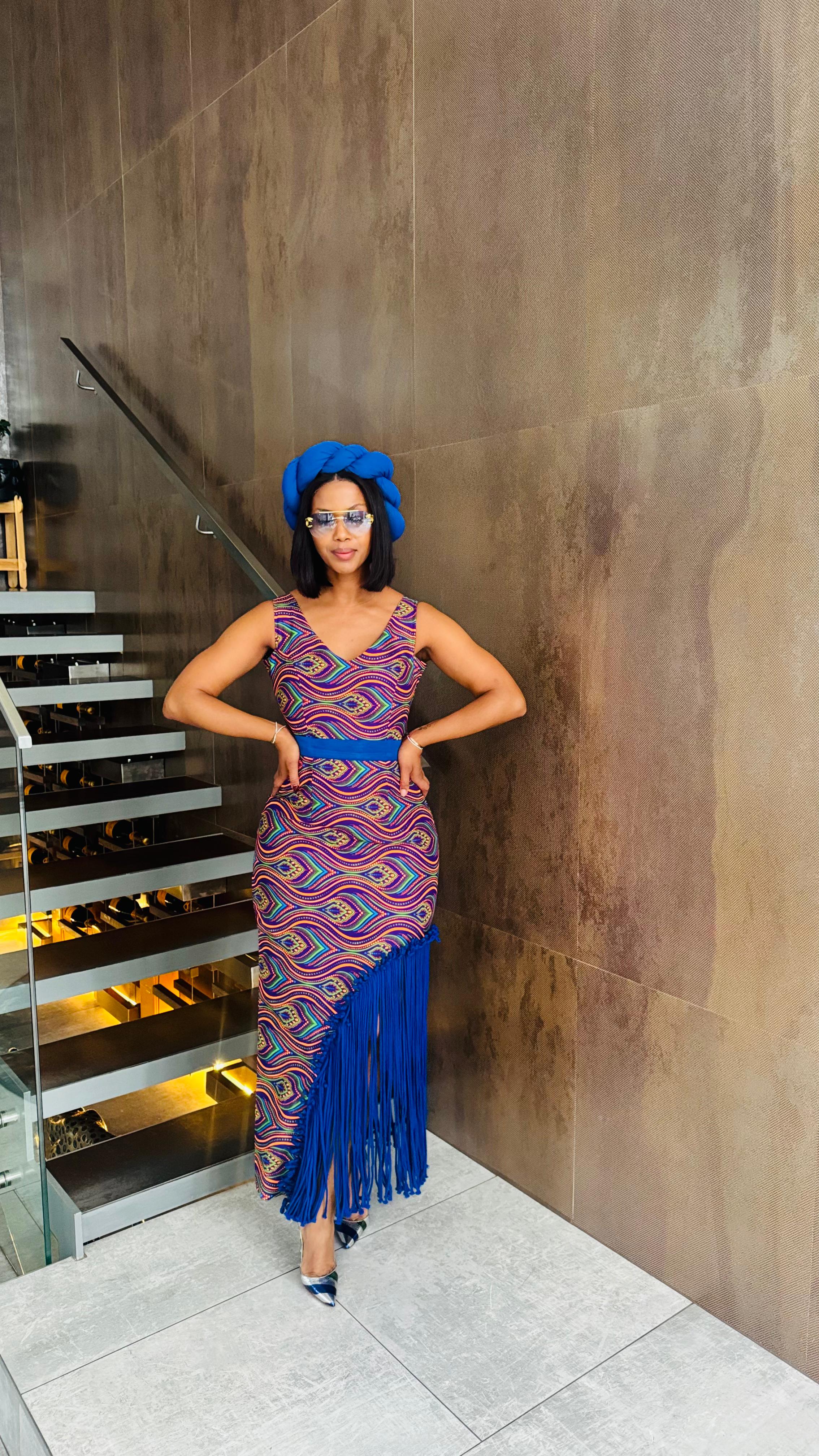 Multicoloured dress with the blue tassels