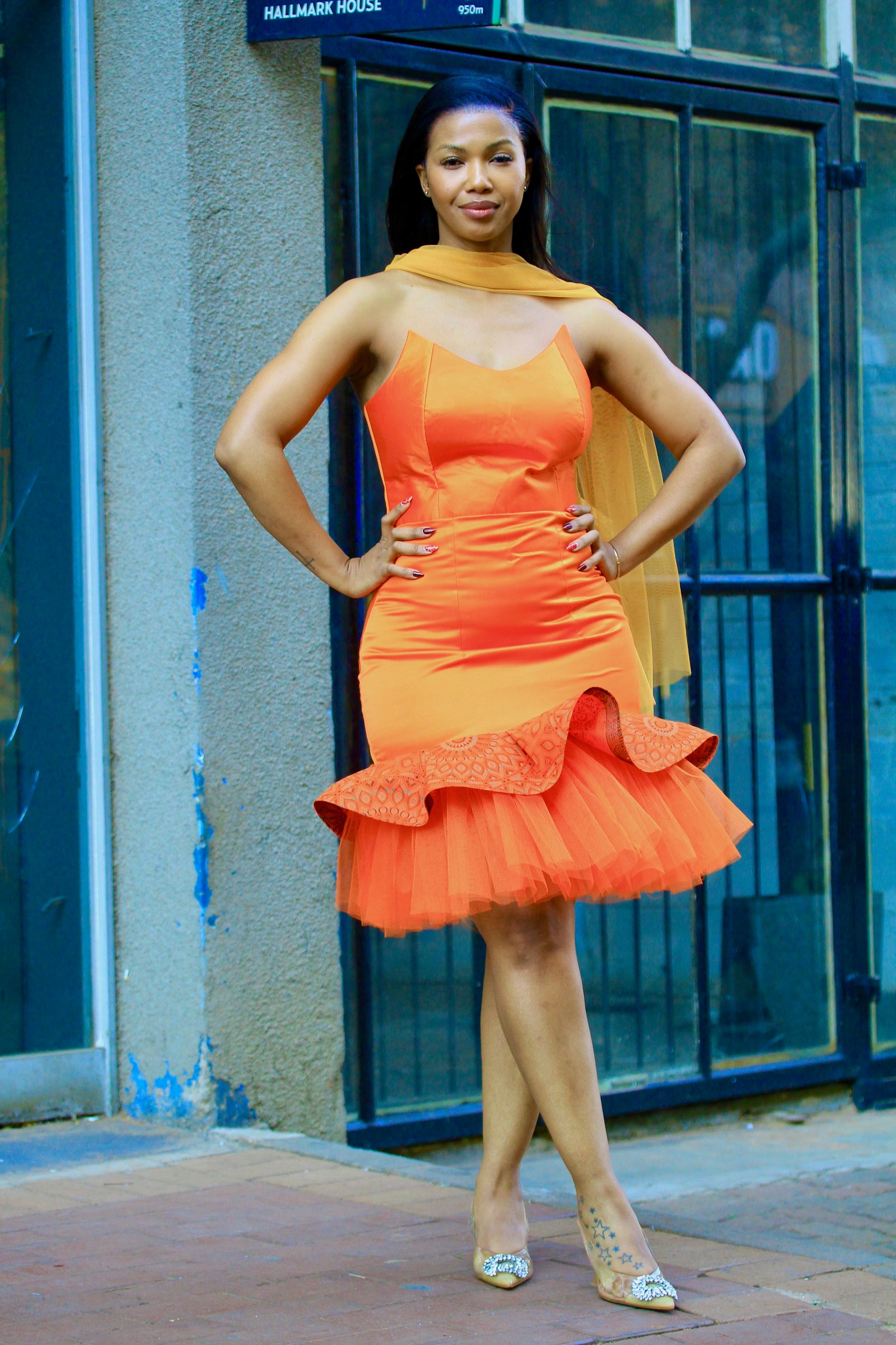 Orange boobtube with a tule