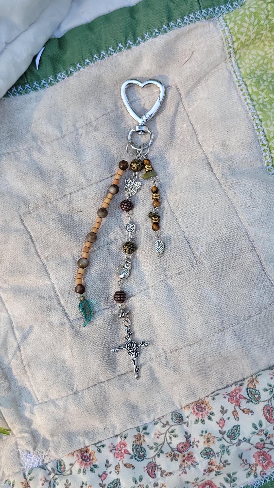 earthy keychain with cross pendant