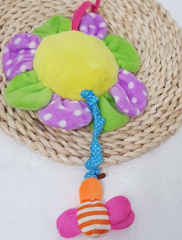 Juguete de peluche bebé Flor musical a cuerda