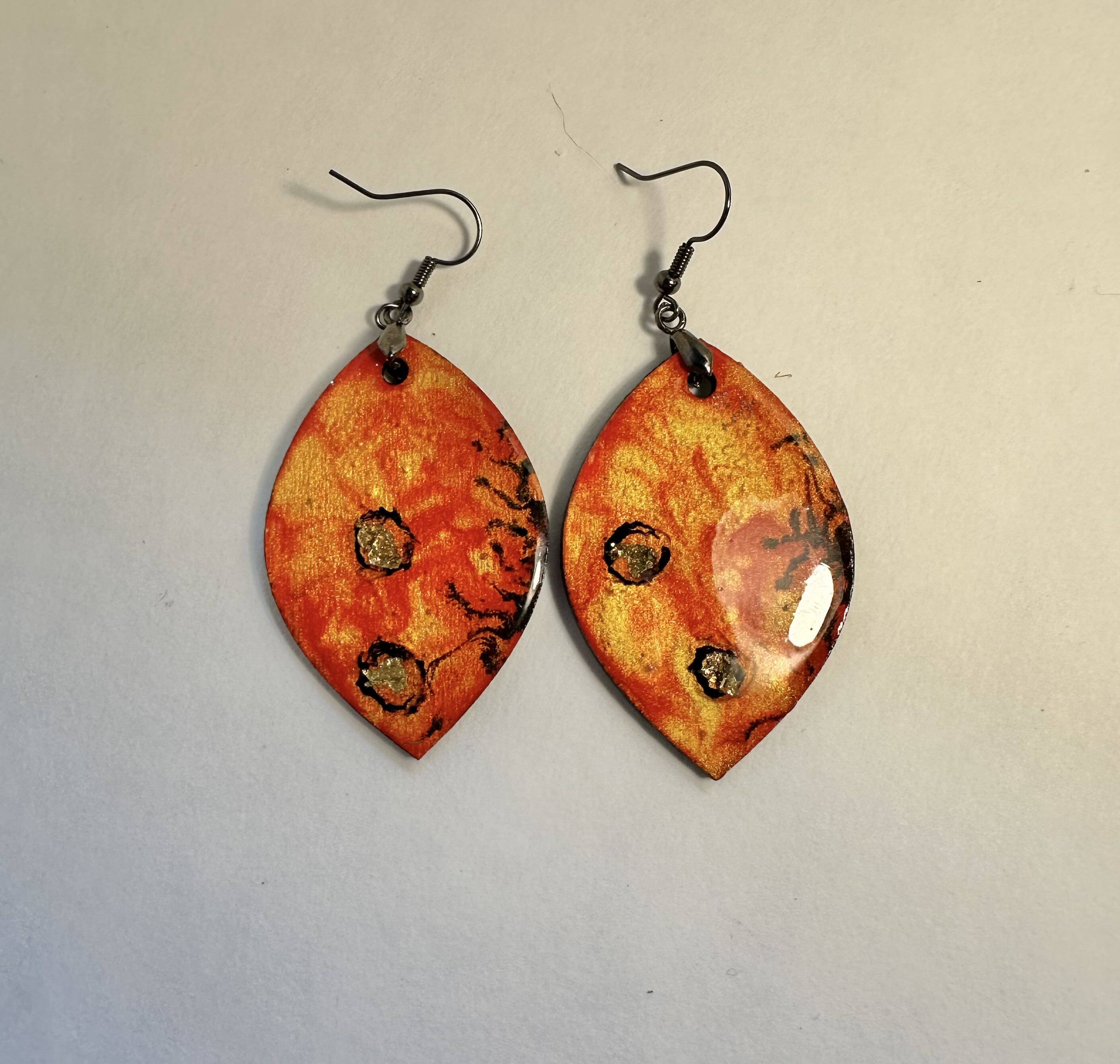 Handmade Orange Leaf Earrings, acrylic ink, paint and gold tone foil. Resin on top.