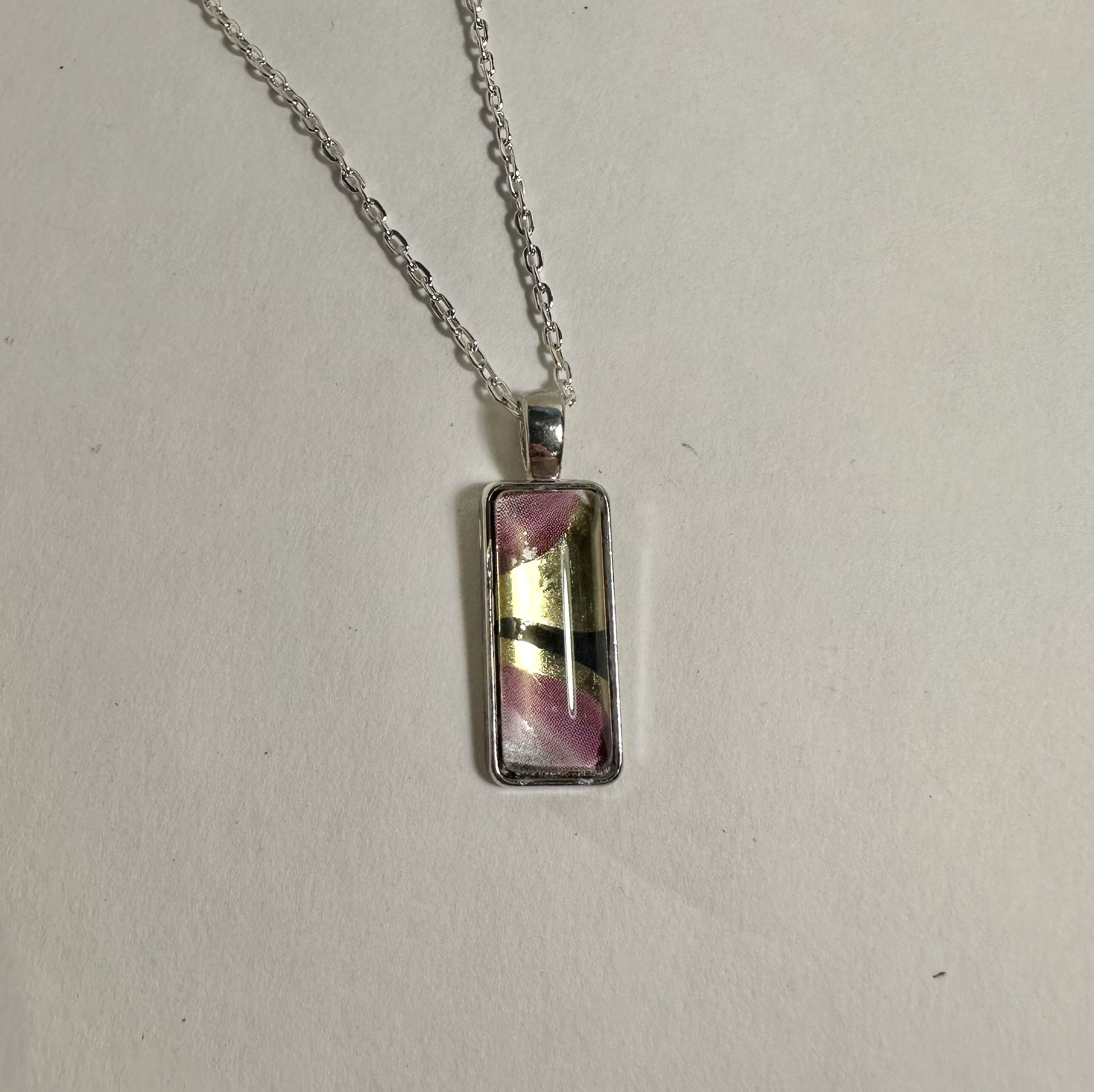 Rectangular Glass Pendant Necklace with artistic paper in a bezel with cabochon.