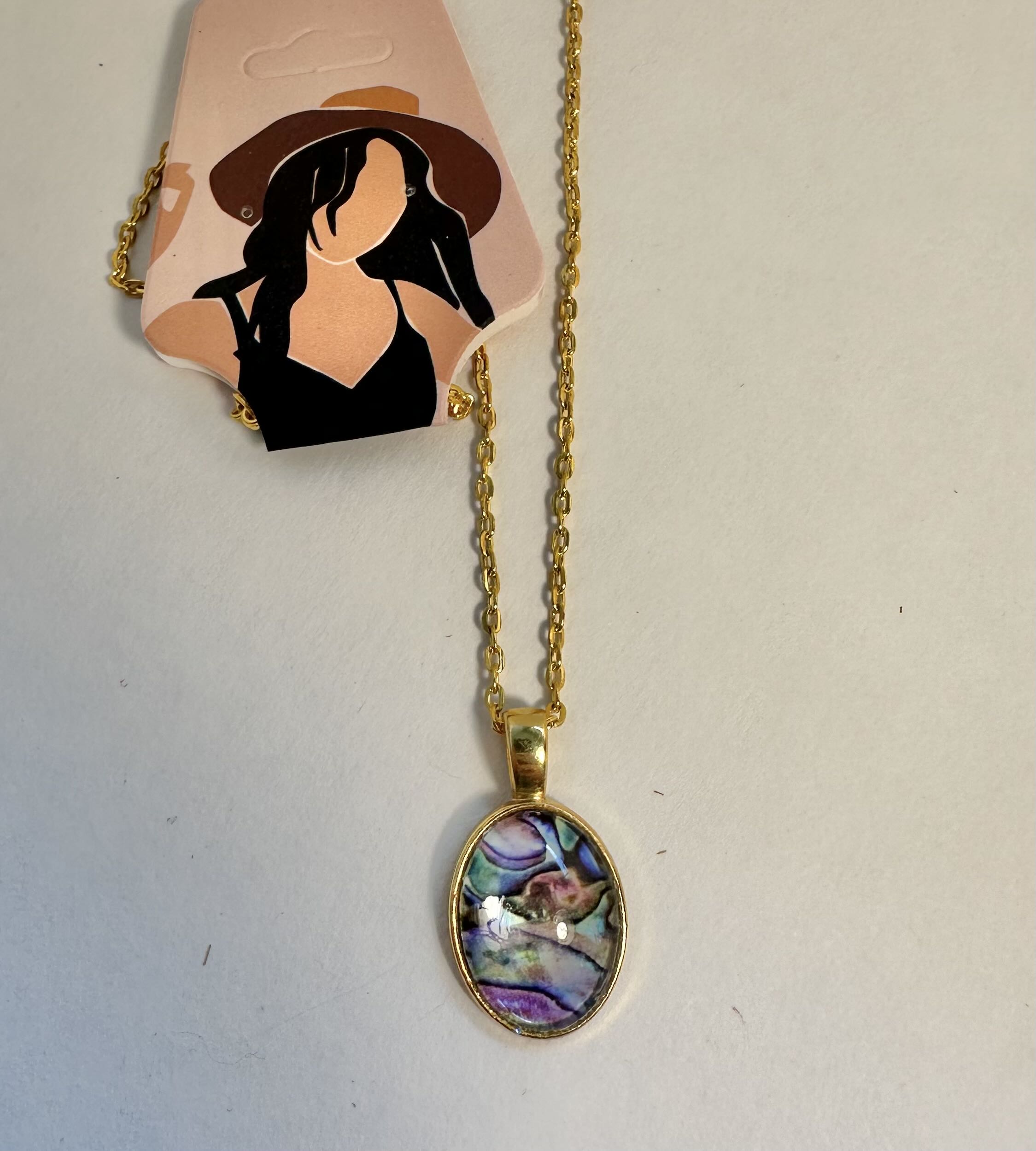 Gold-toned Chain Necklace with Abalone Shell Pendant made with vinyl in a bezel and cabochon. 