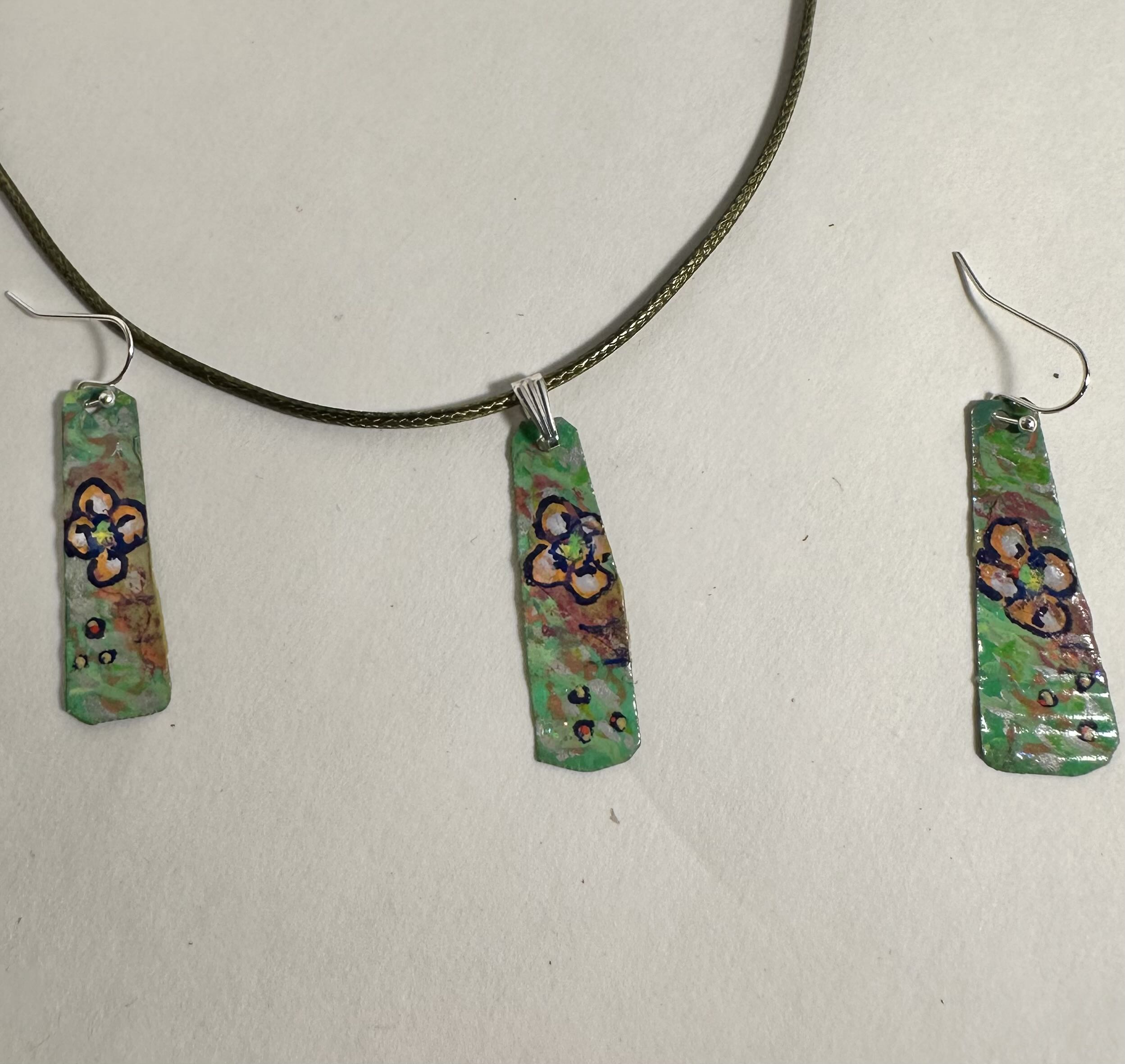 Handcrafted Floral Jewelry Set made with recycling metal, acrylic paint, collage paper and spray sealer.