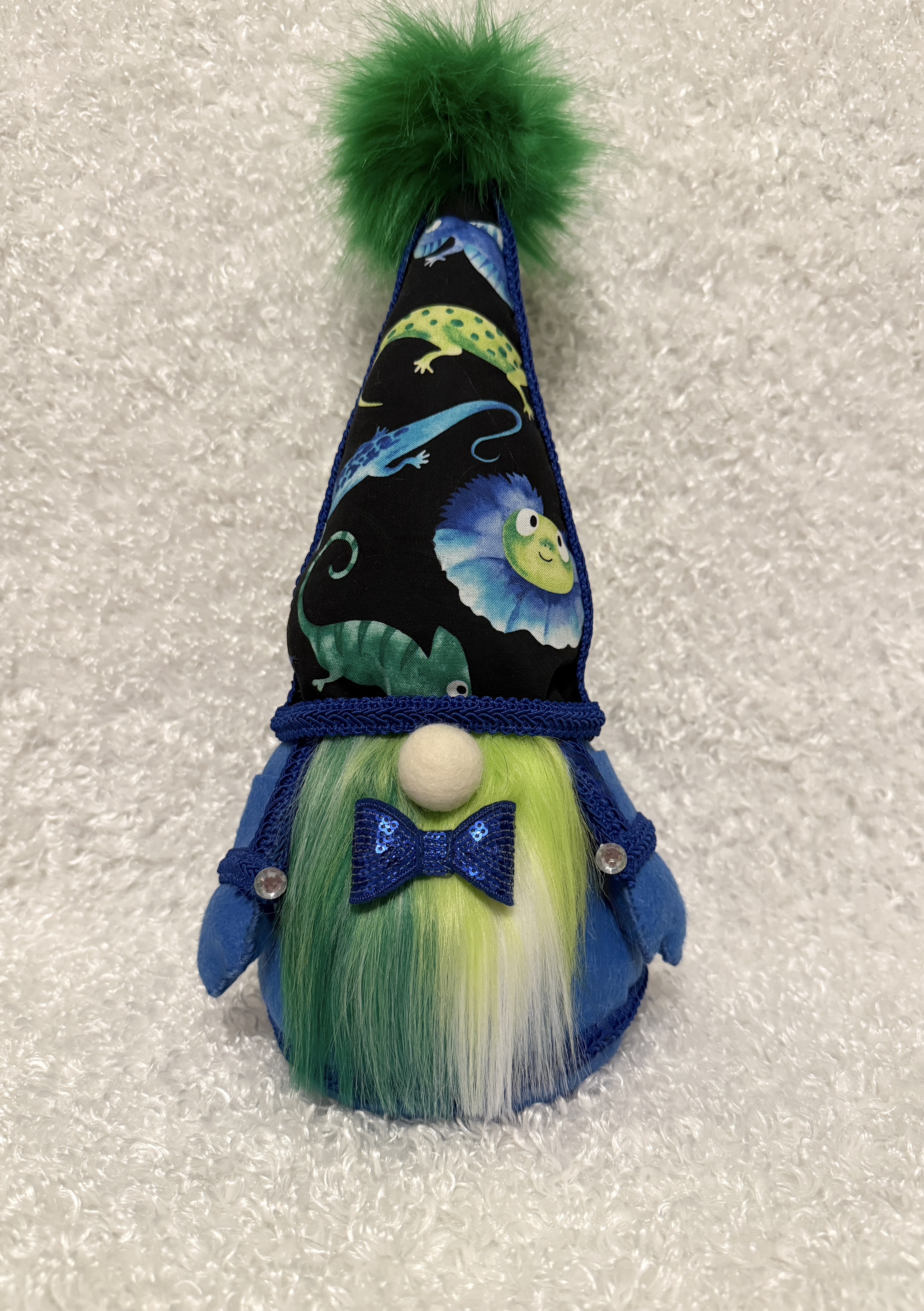 Whimsical Gnome with Lizard-Themed Hat and Fluffy Green Shaded Beard