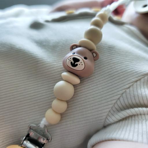 Naujagimio čiulptuko laikiklis MEŠKUTIS, smėlinis