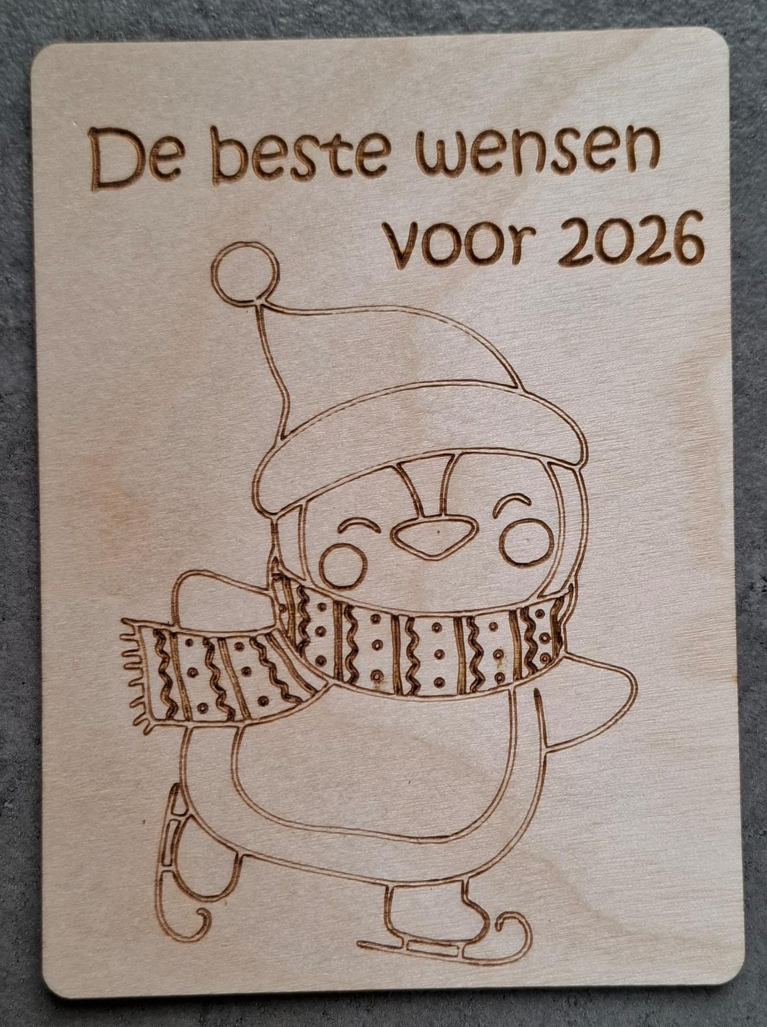 Kerstkaart - pinguin schaatsen