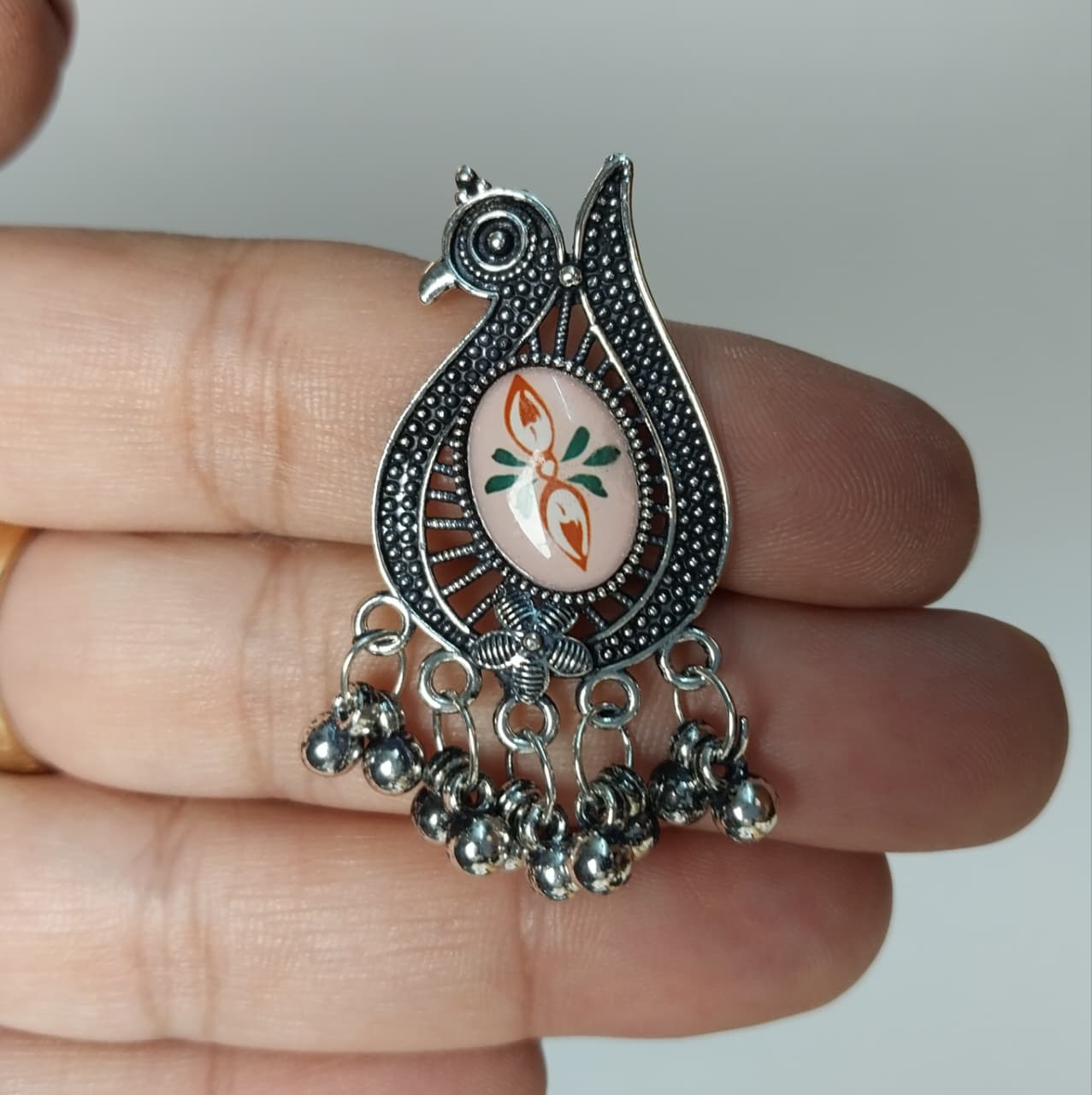 Peacock-shaped silver oxidized earrings