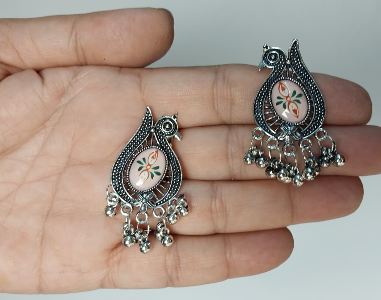 Peacock-shaped silver oxidized earrings