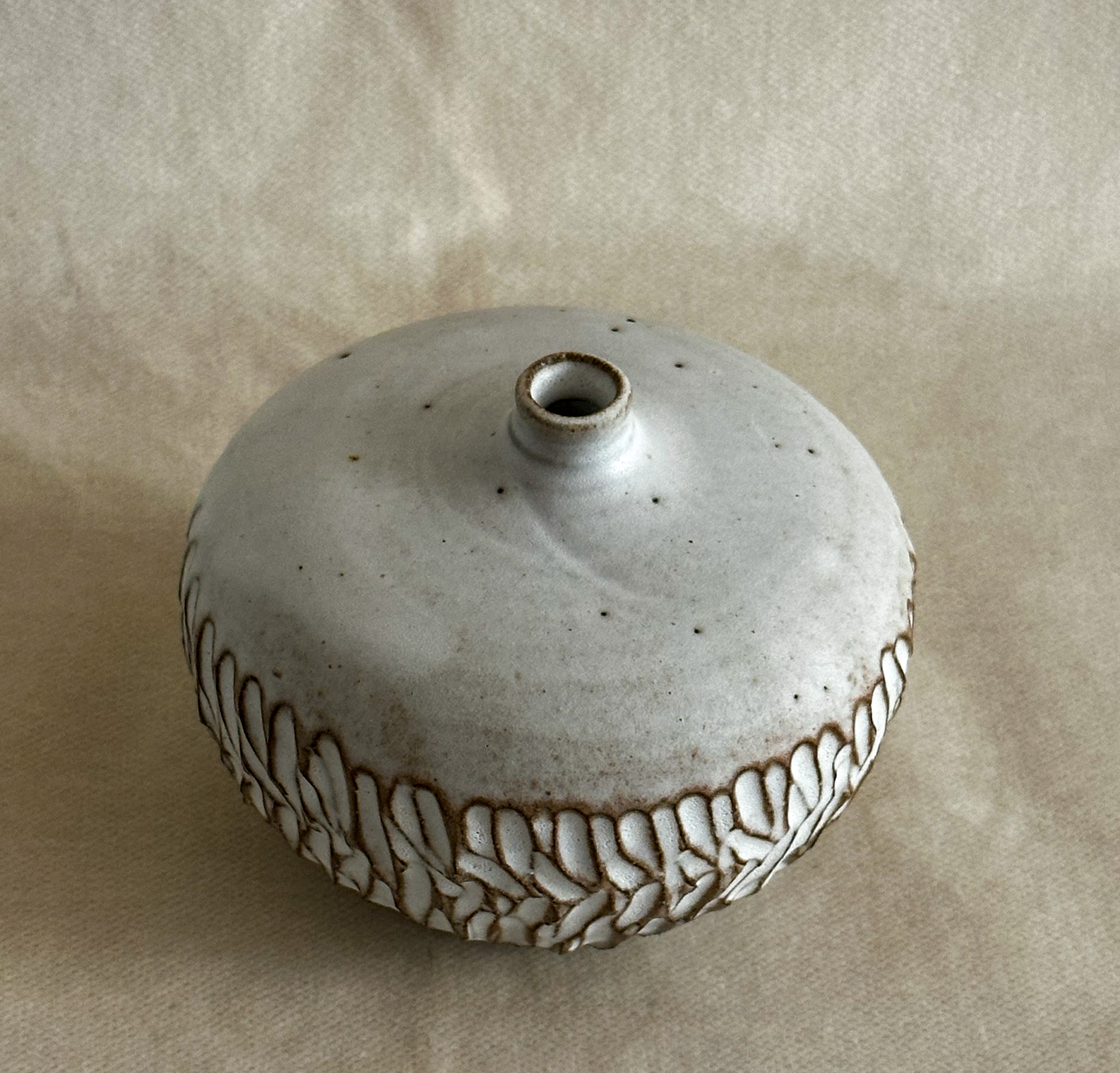 Small carved vase in white