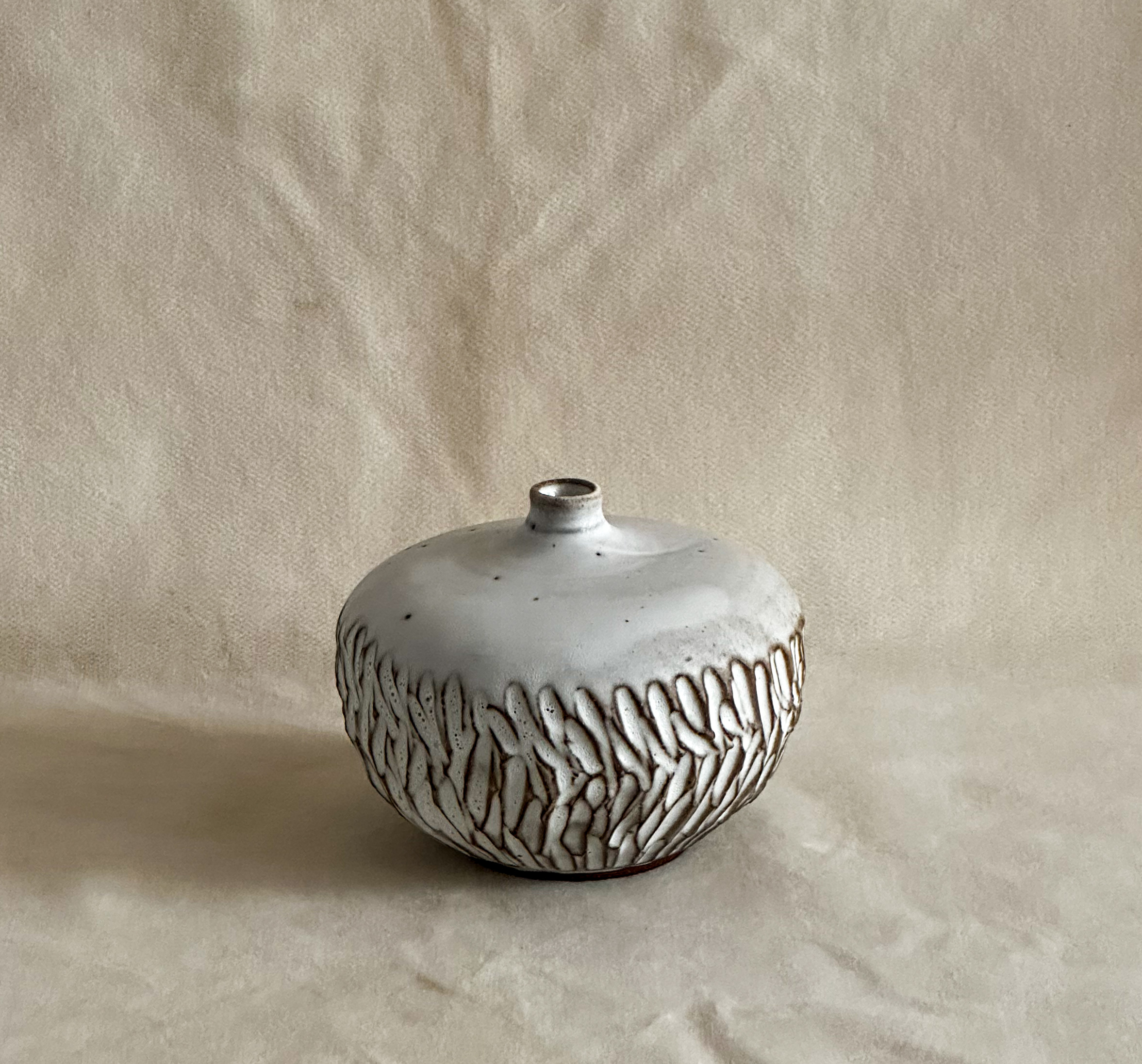 Small carved vase in white