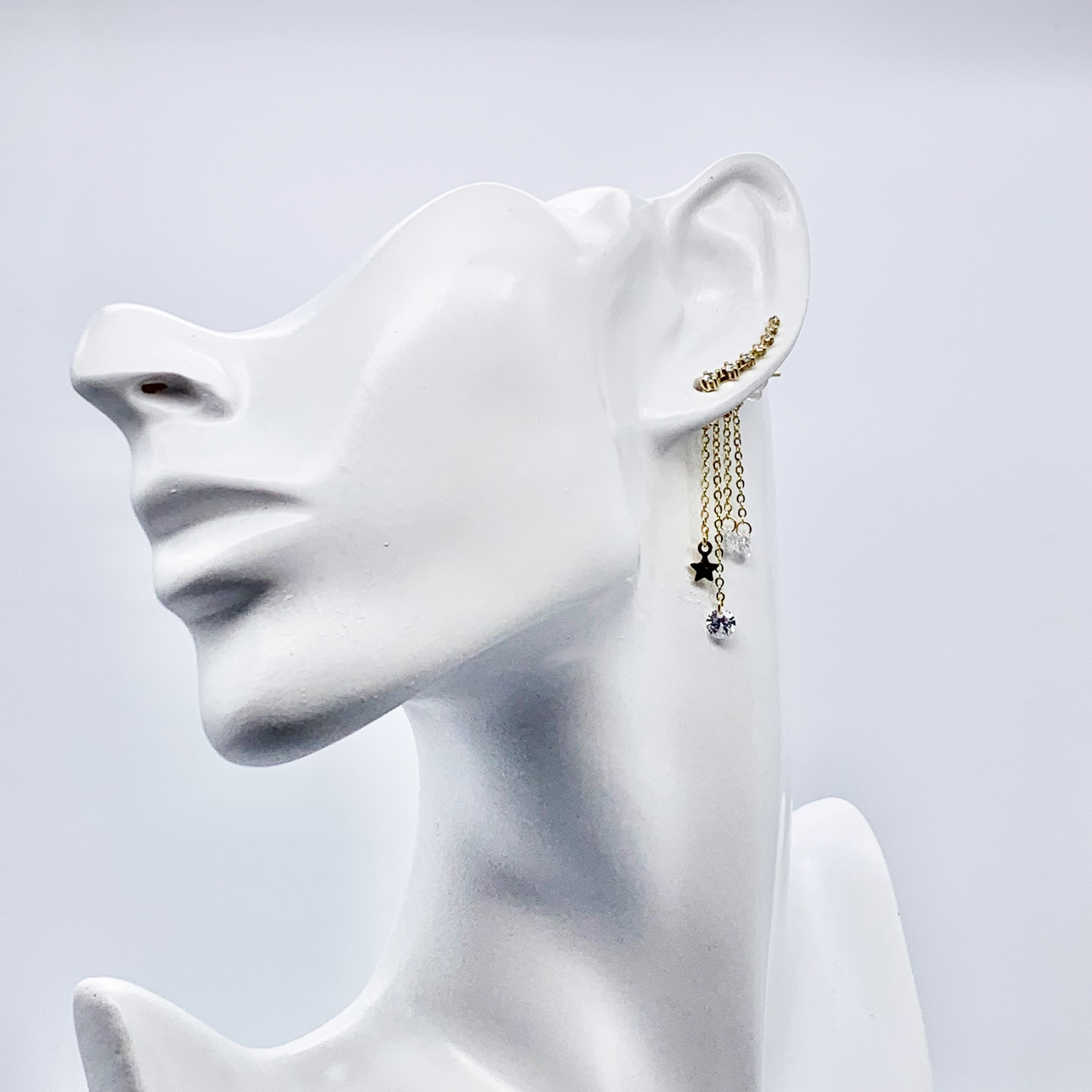 Gold Earrings With a Dangle Star Crystal Drop