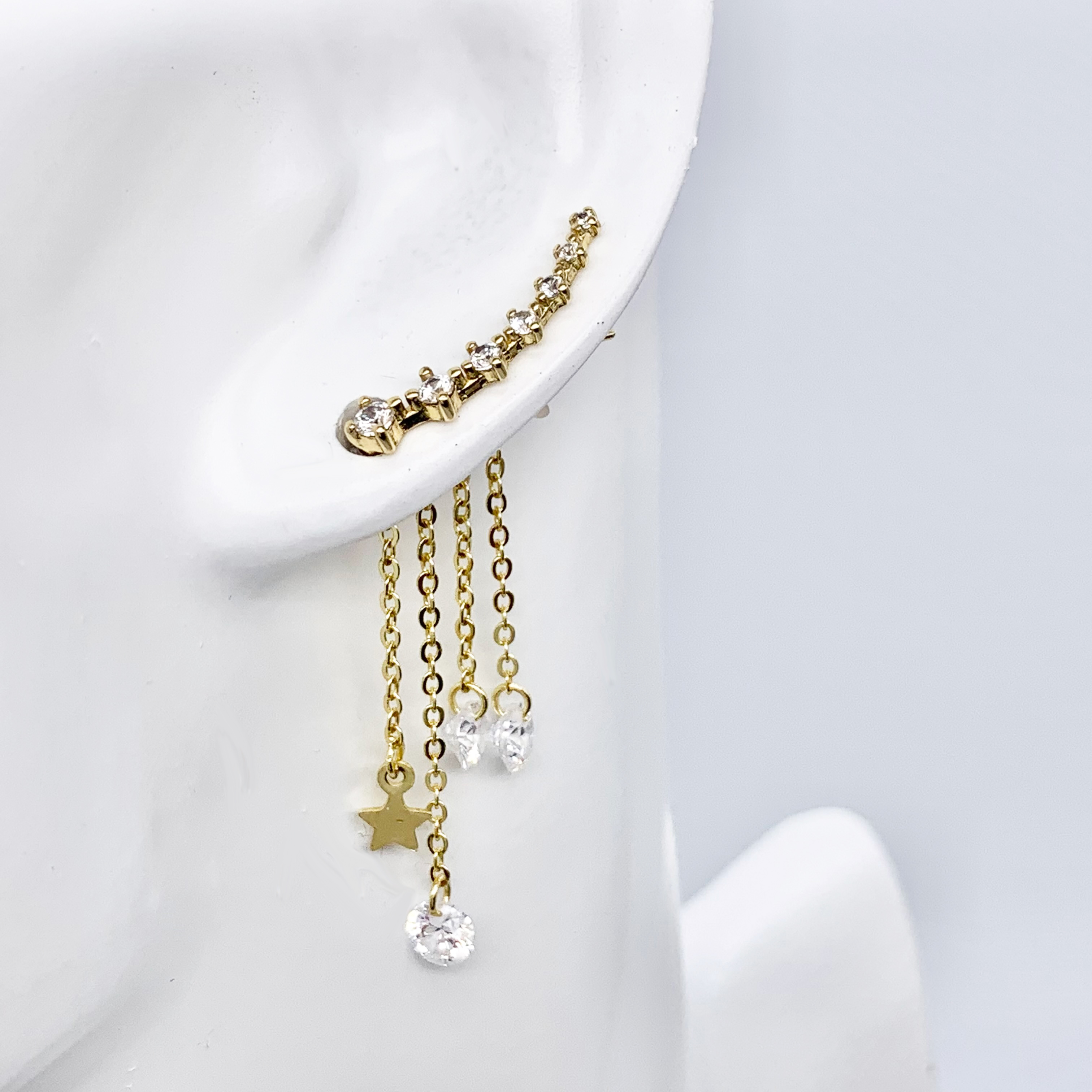 Gold Earrings With a Dangle Star Crystal Drop