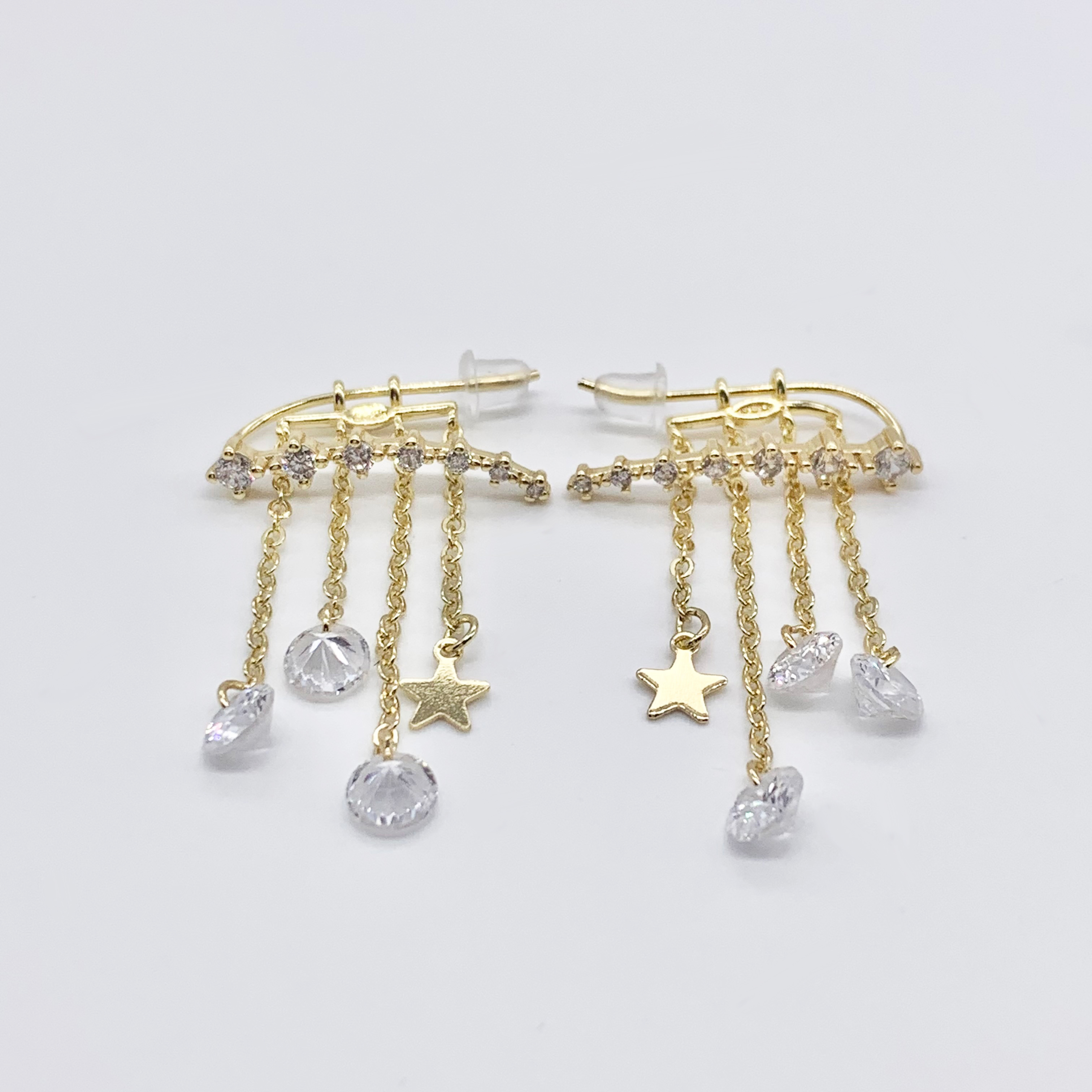 Gold Earrings With a Dangle Star Crystal Drop