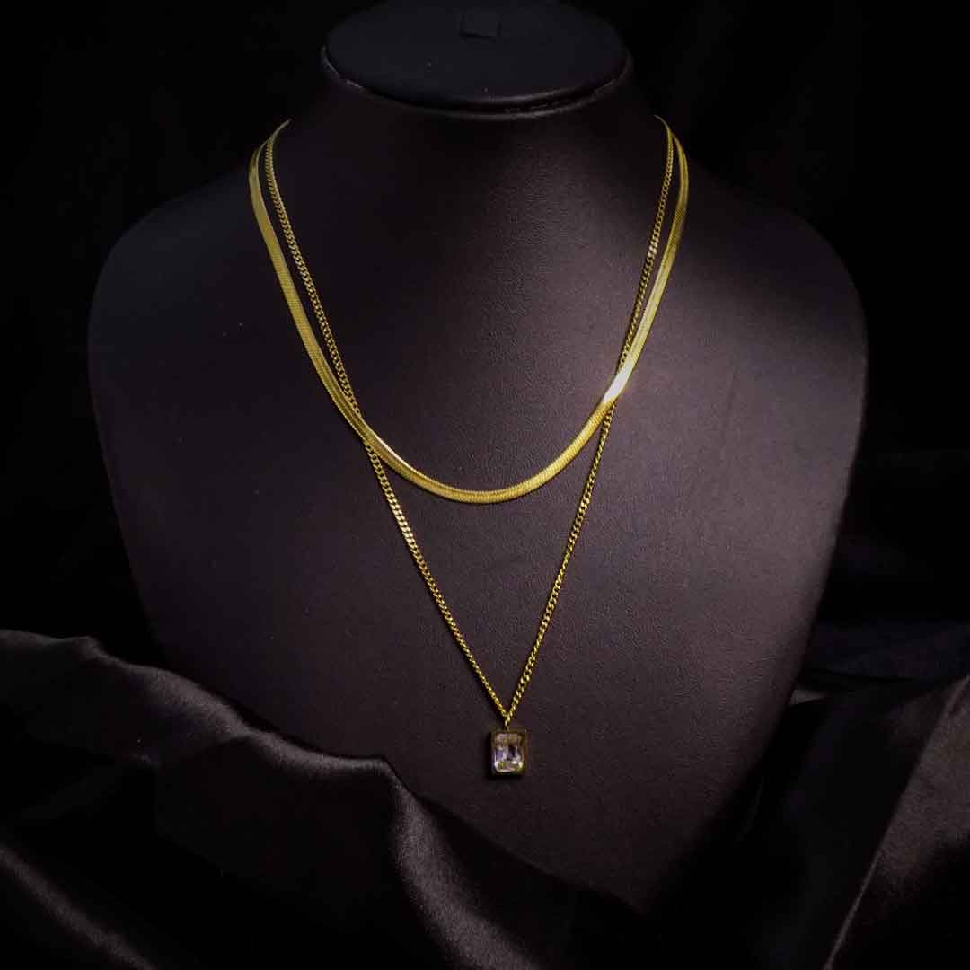 Gold layered necklace with crystal pendant