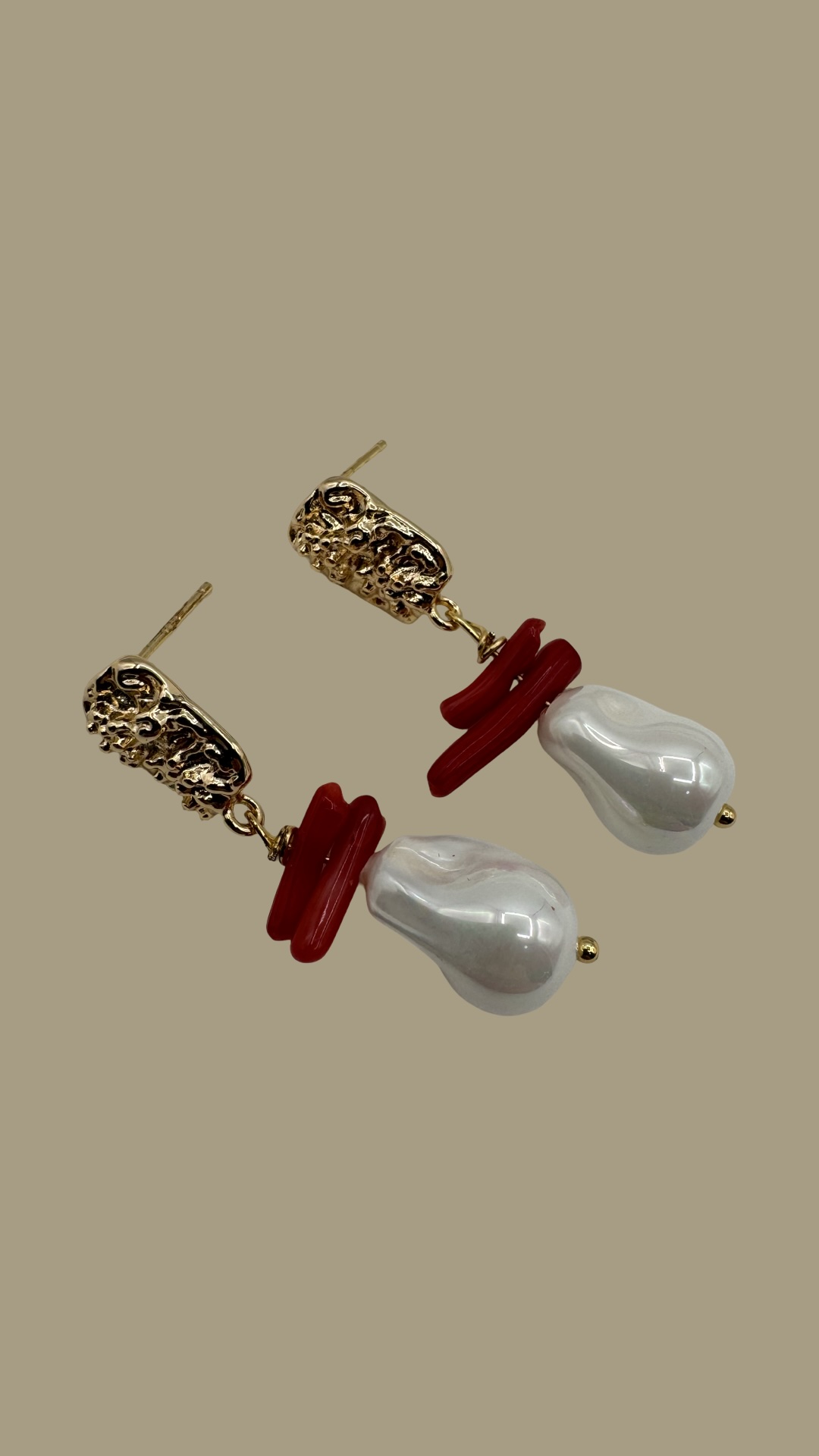 Gold textured earrings with baroque pearls and red coral