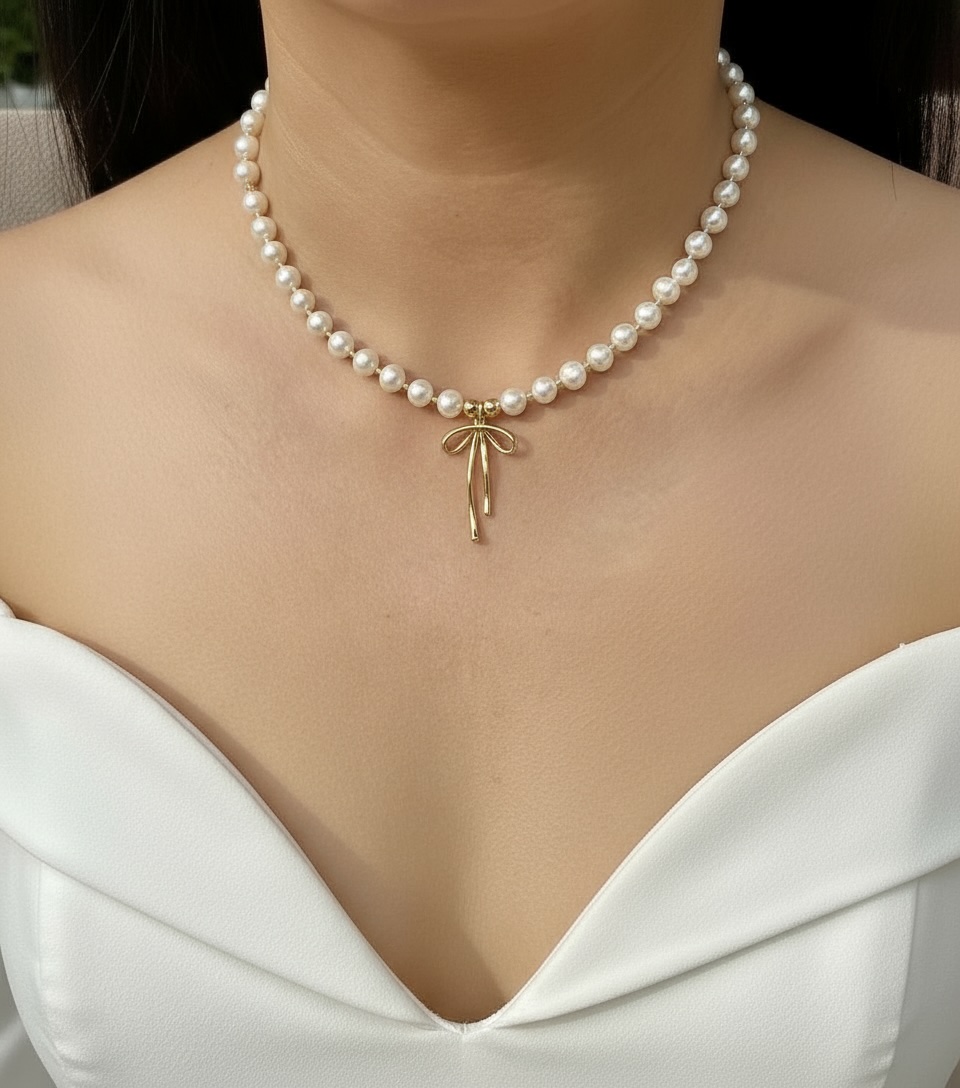 Pearl Necklace with Gold Bow Pendant