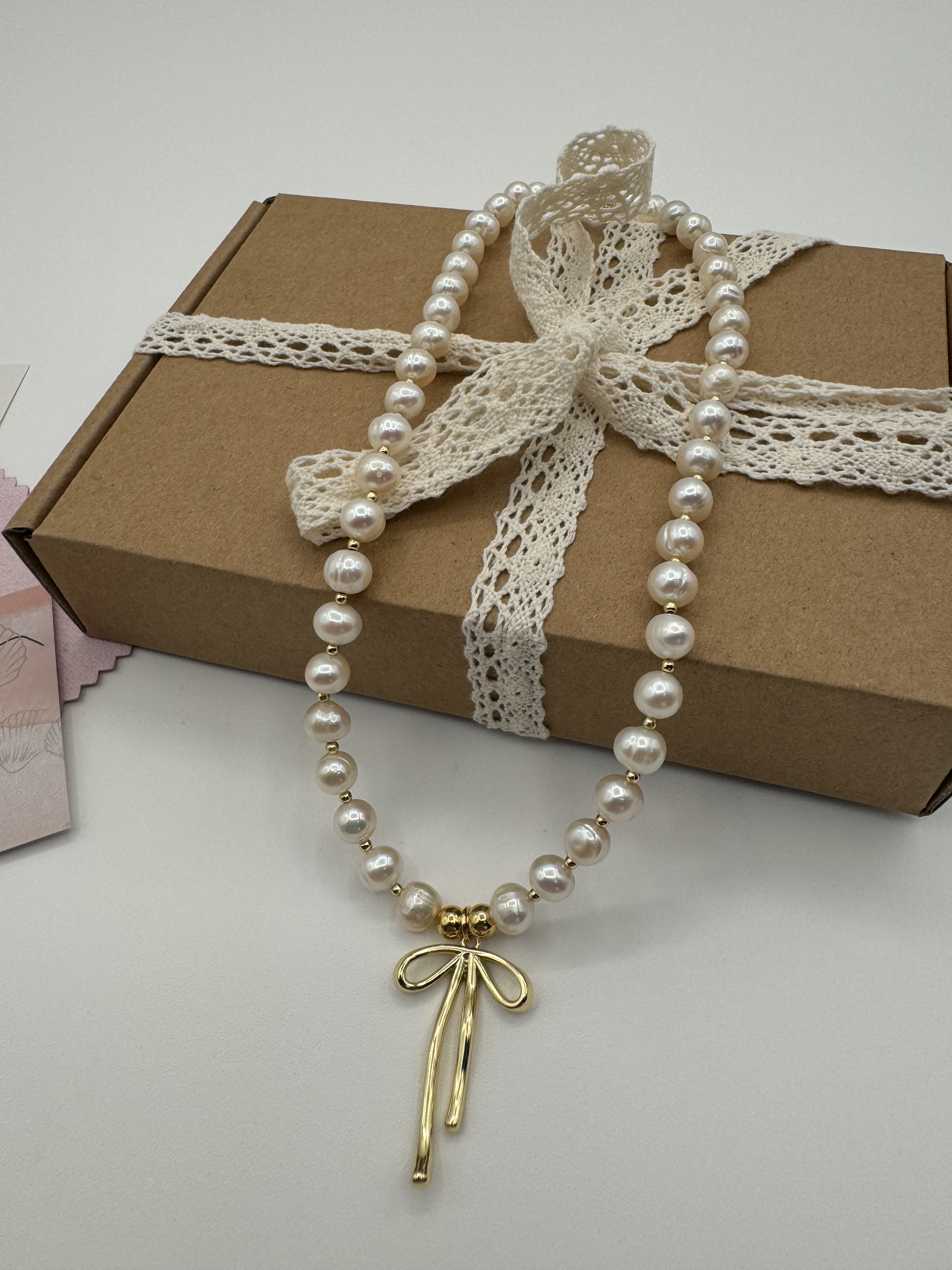 Pearl Necklace with Gold Bow Pendant