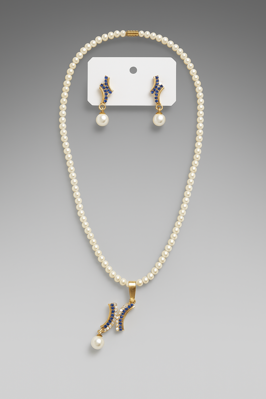 Elegant pearl and blue stone jewelry set