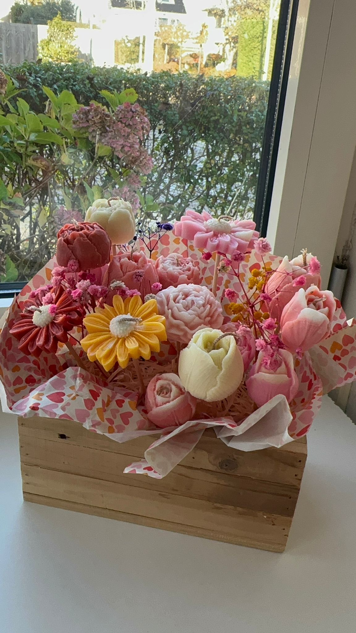 A luxurious collection of natural soy wax candles in the shape of roses in assorted colors