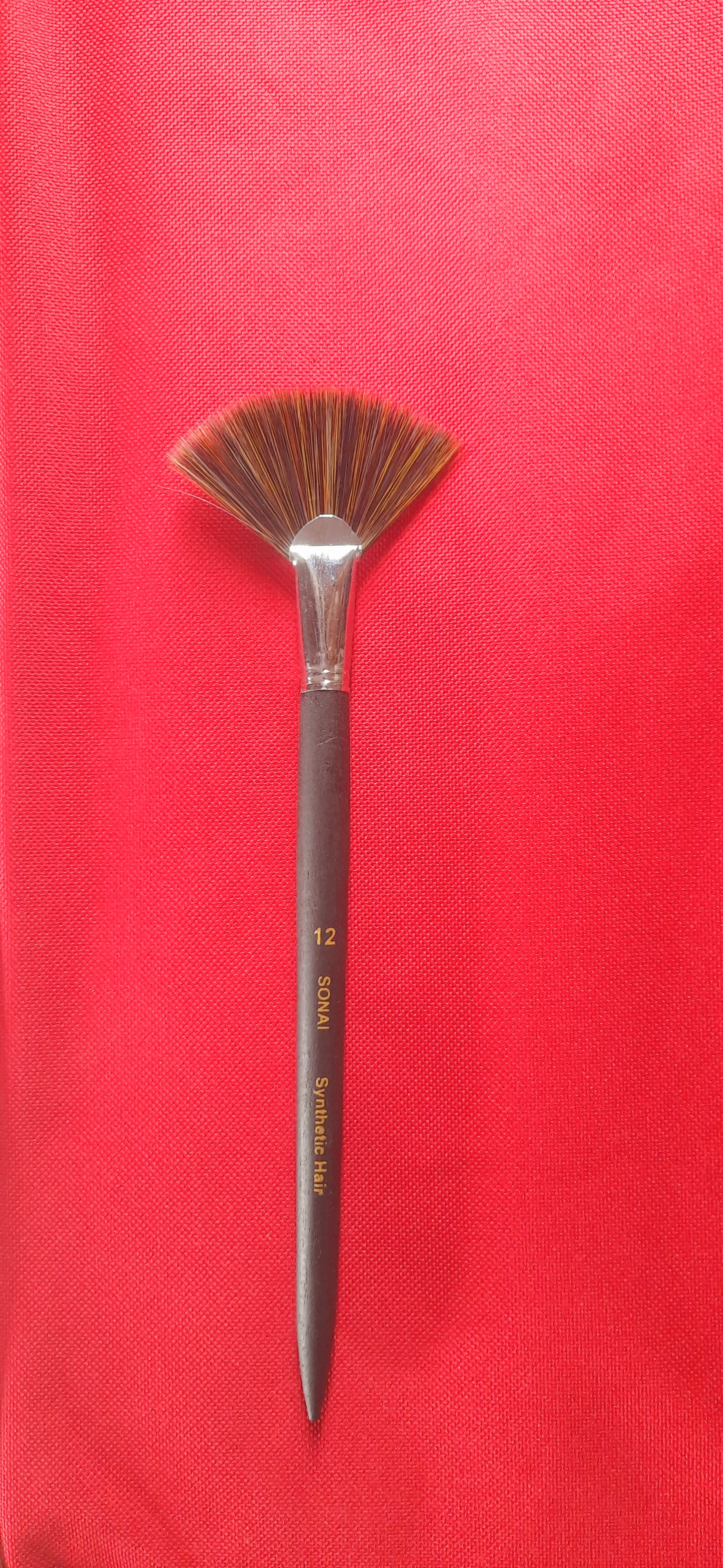 Fan blade brush