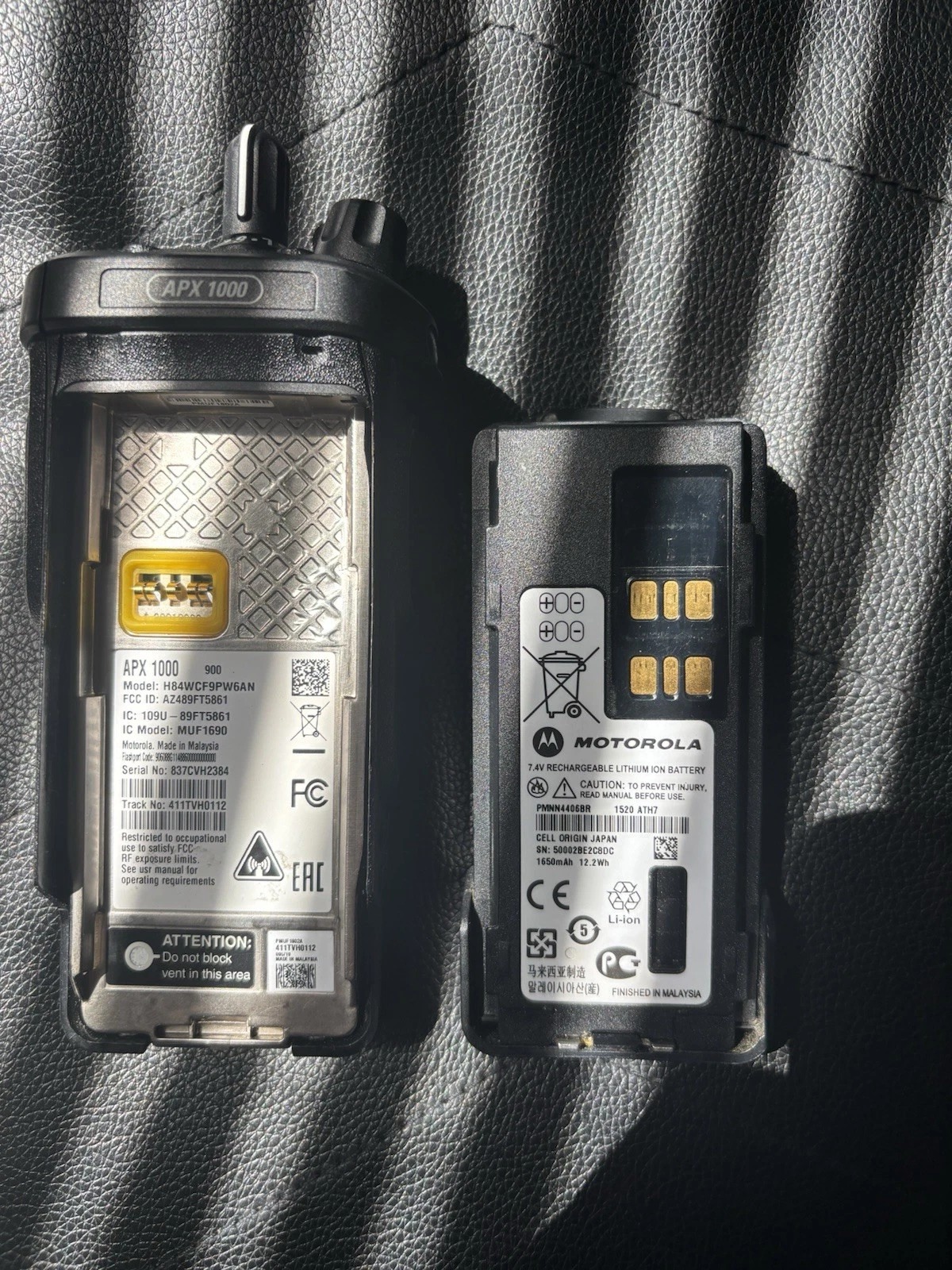 A Motorola Apx1000 with A Charger and A Programming Cord Tested