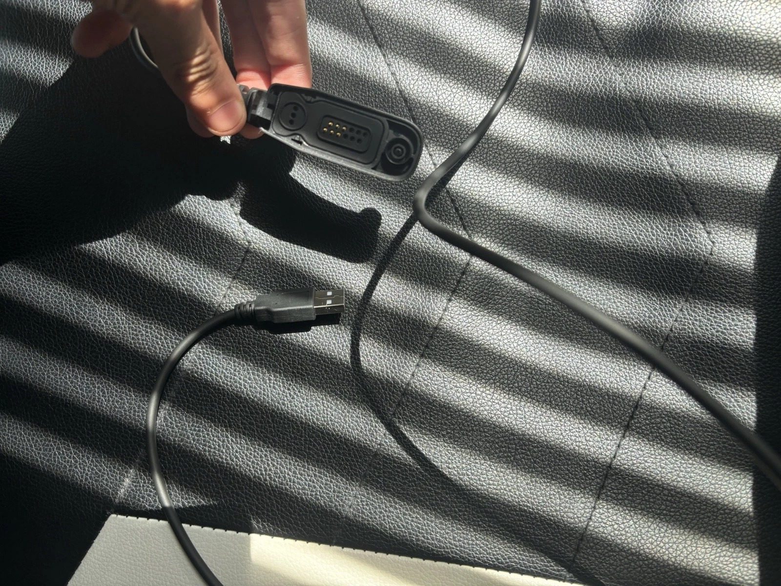 A Motorola Apx1000 with A Charger and A Programming Cord Tested