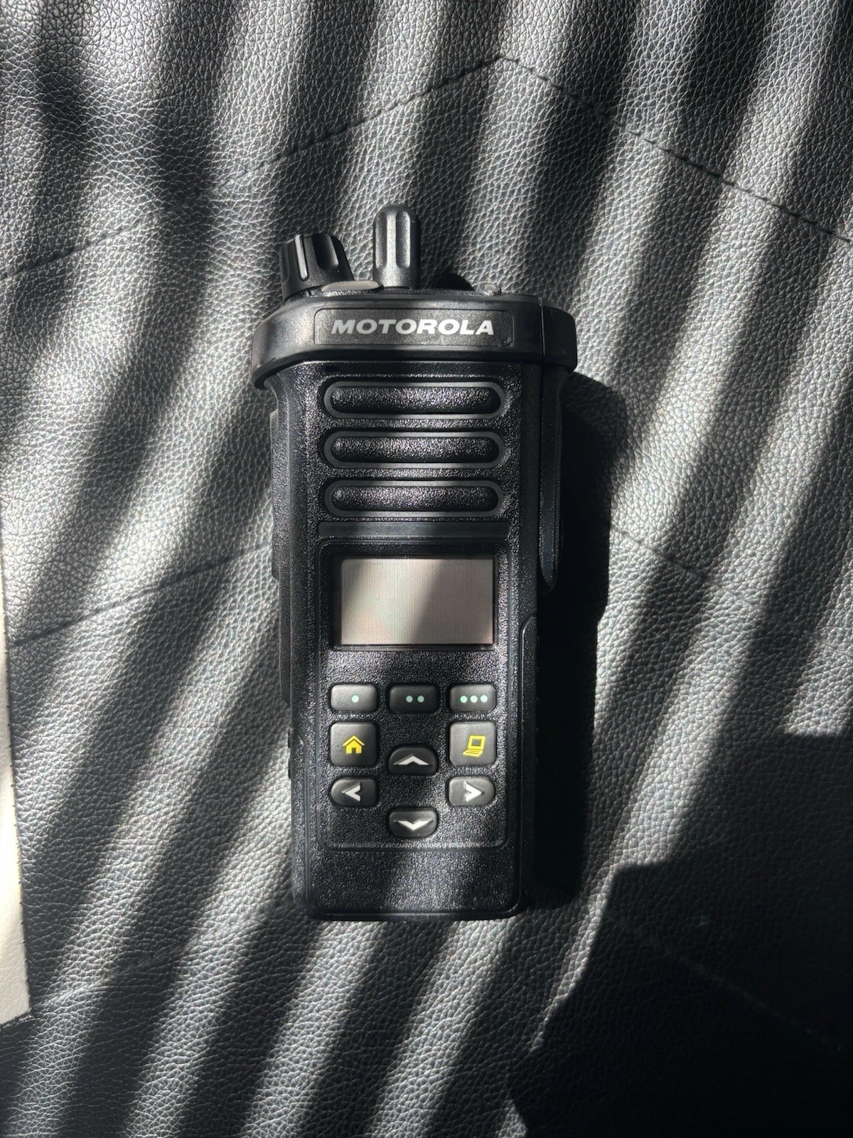 A Motorola Apx1000 with A Charger and A Programming Cord Tested