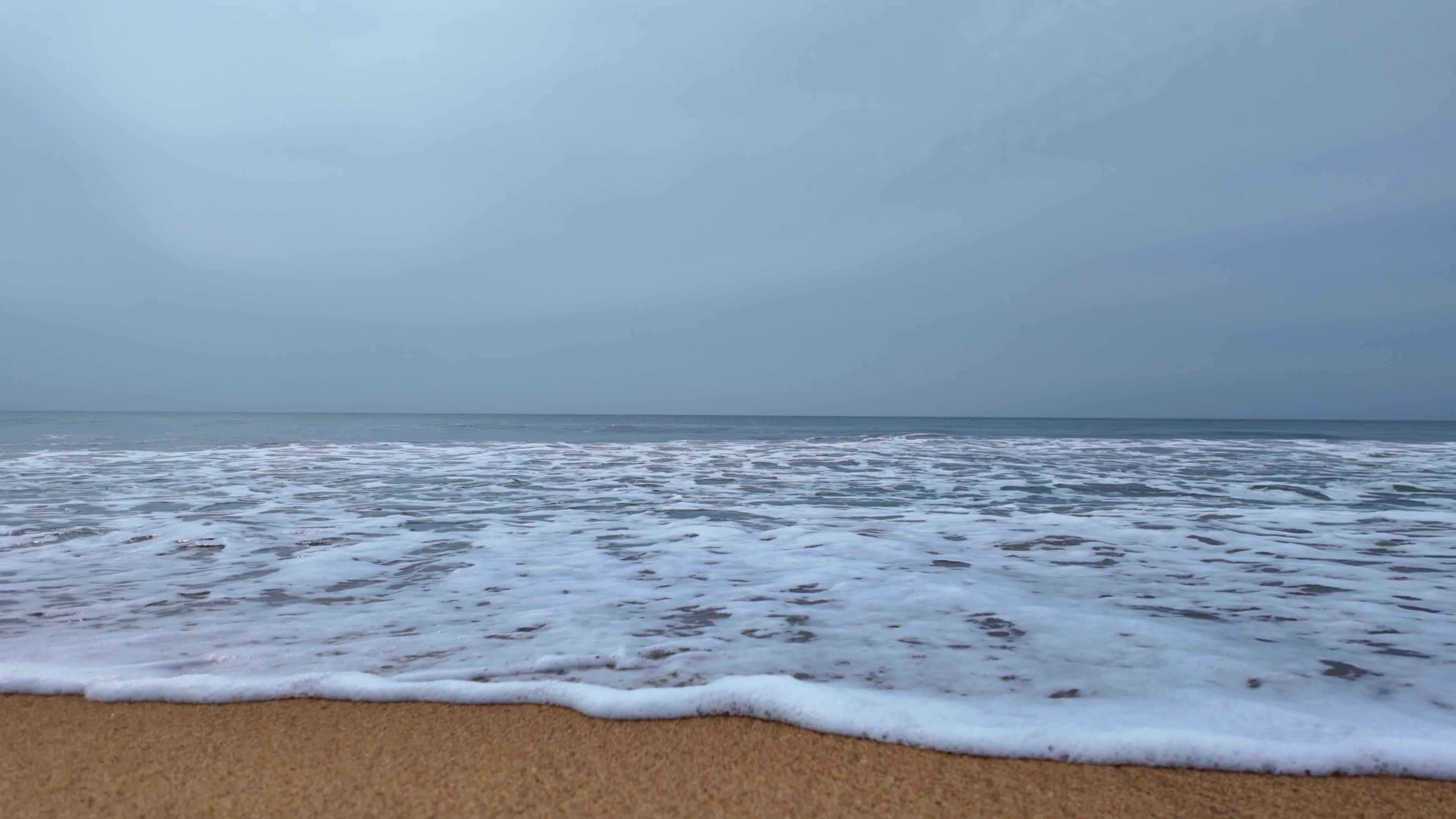Slow Motion Ocean Waves Rolling onto Sandy Beach - Premium Waves Stock Footages