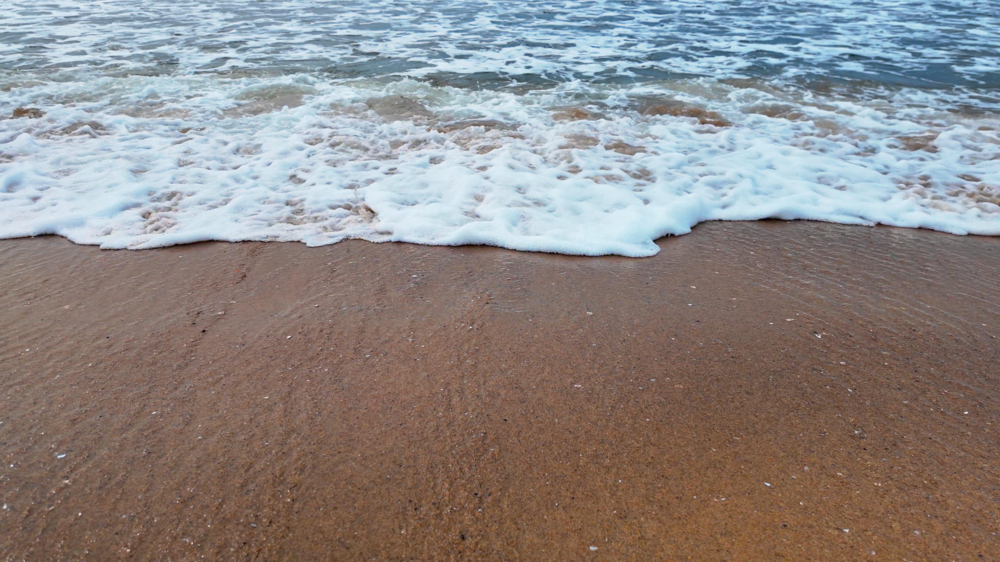 Waves Foam Smooth Crashing Seashore 4K Closeup